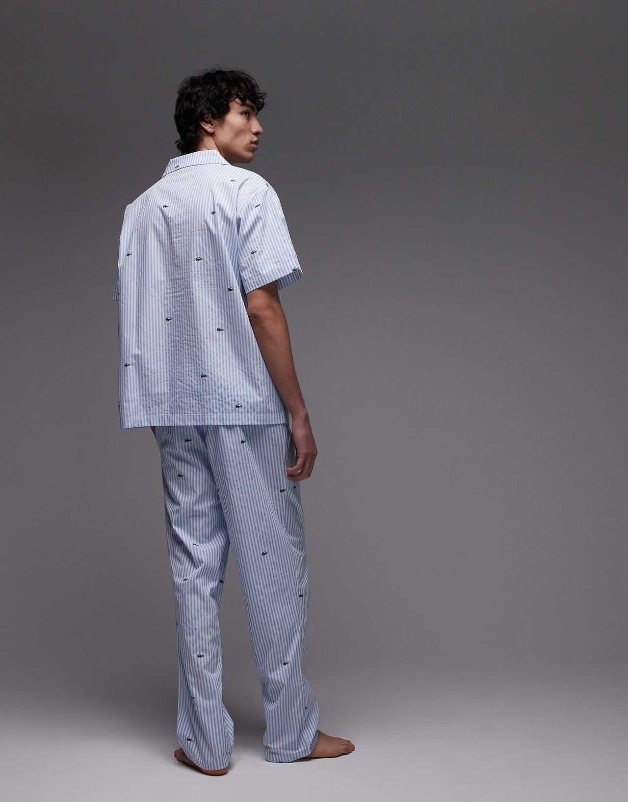Lacoste loungewear trousers in light blue with all over croc print