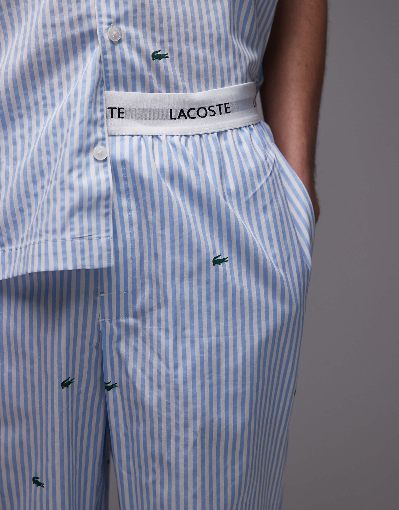Lacoste loungewear trousers in light blue with all over croc print