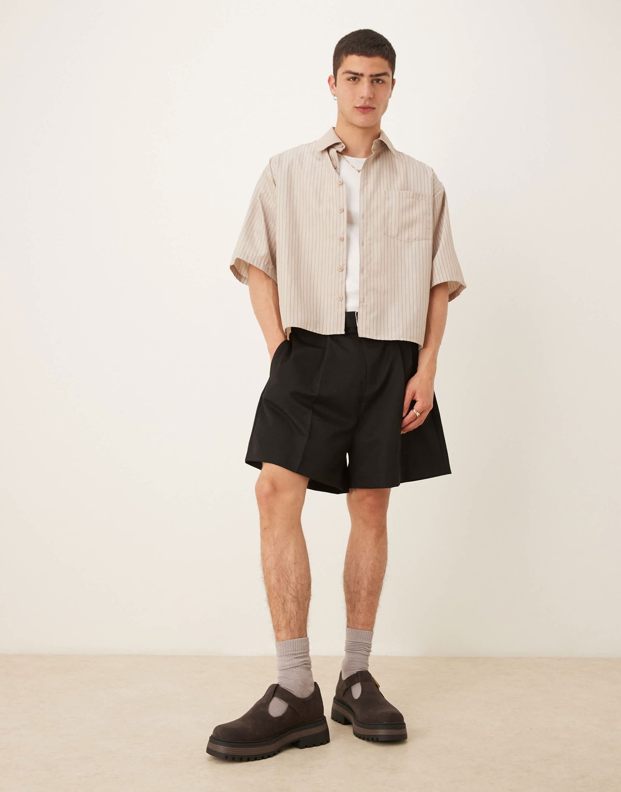 ASOS DESIGN smart bermuda shorts with front pleat and belt detail in black