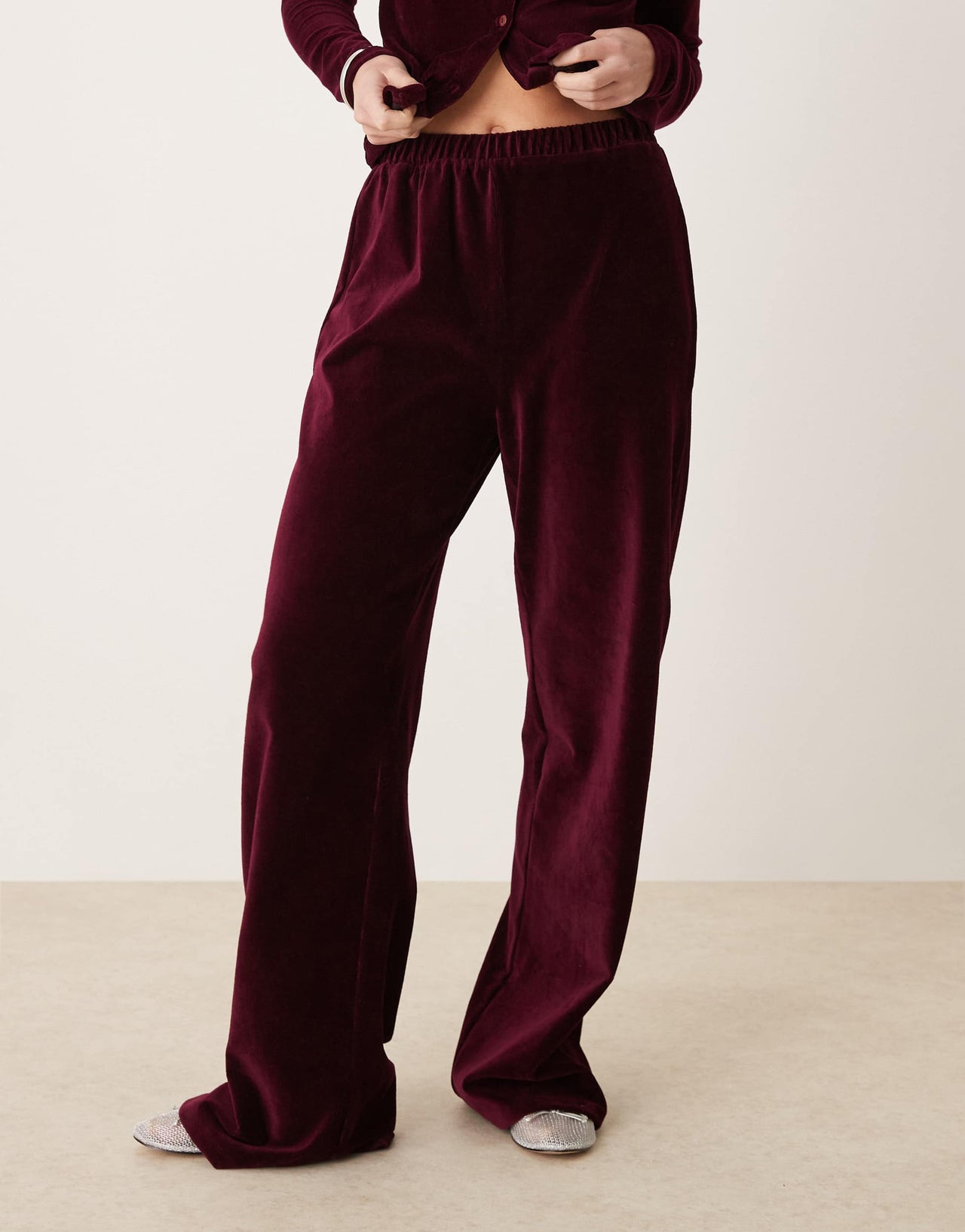 ASOS DESIGN wide leg velvet cord trousers in burgundy