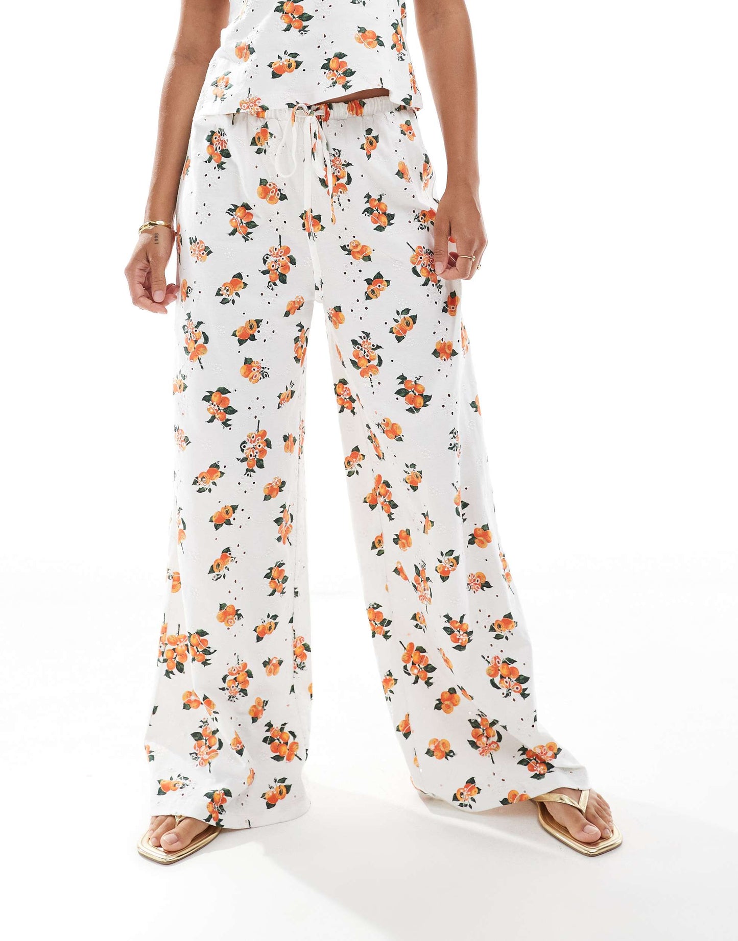 ASOS DESIGN broderie pyjama style trouser co-ord with tie waist in white orange print