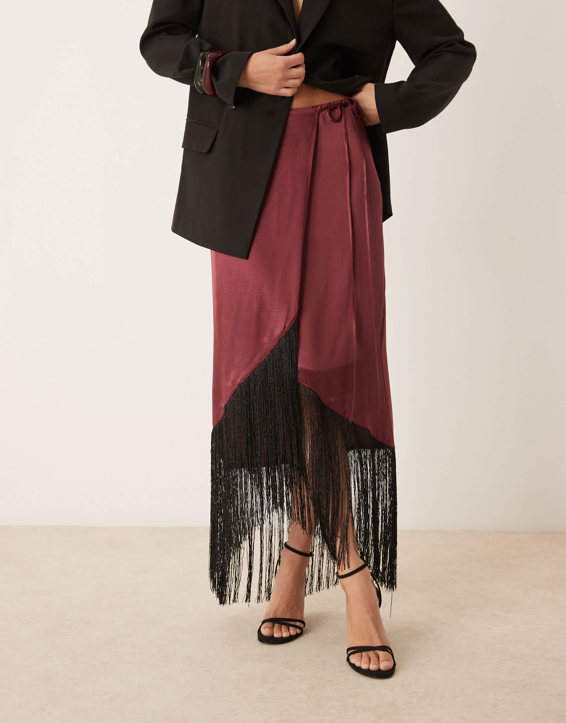 ASOS DESIGN satin wrap skirt with fringe hem in burgundy