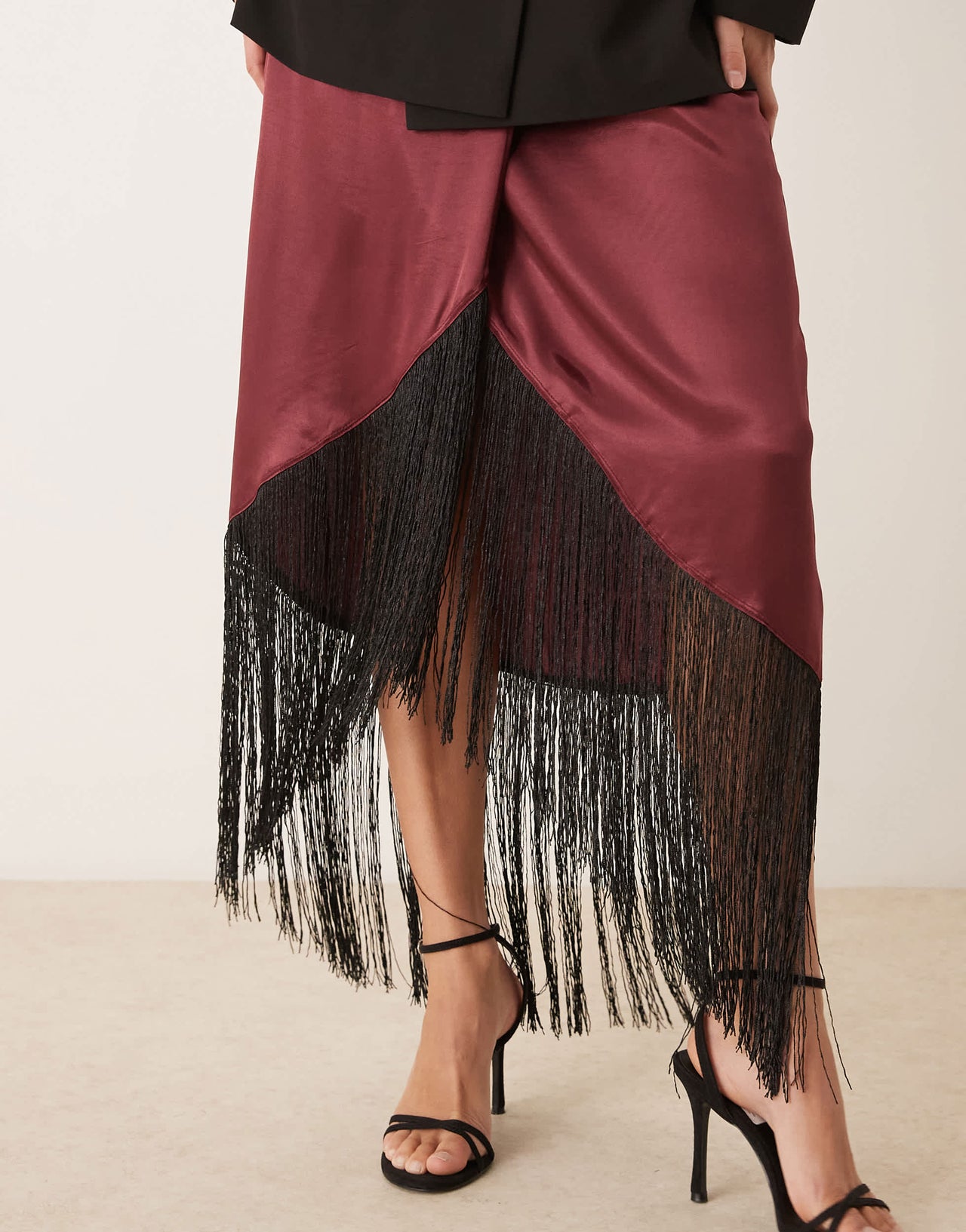 ASOS DESIGN satin wrap skirt with fringe hem in burgundy