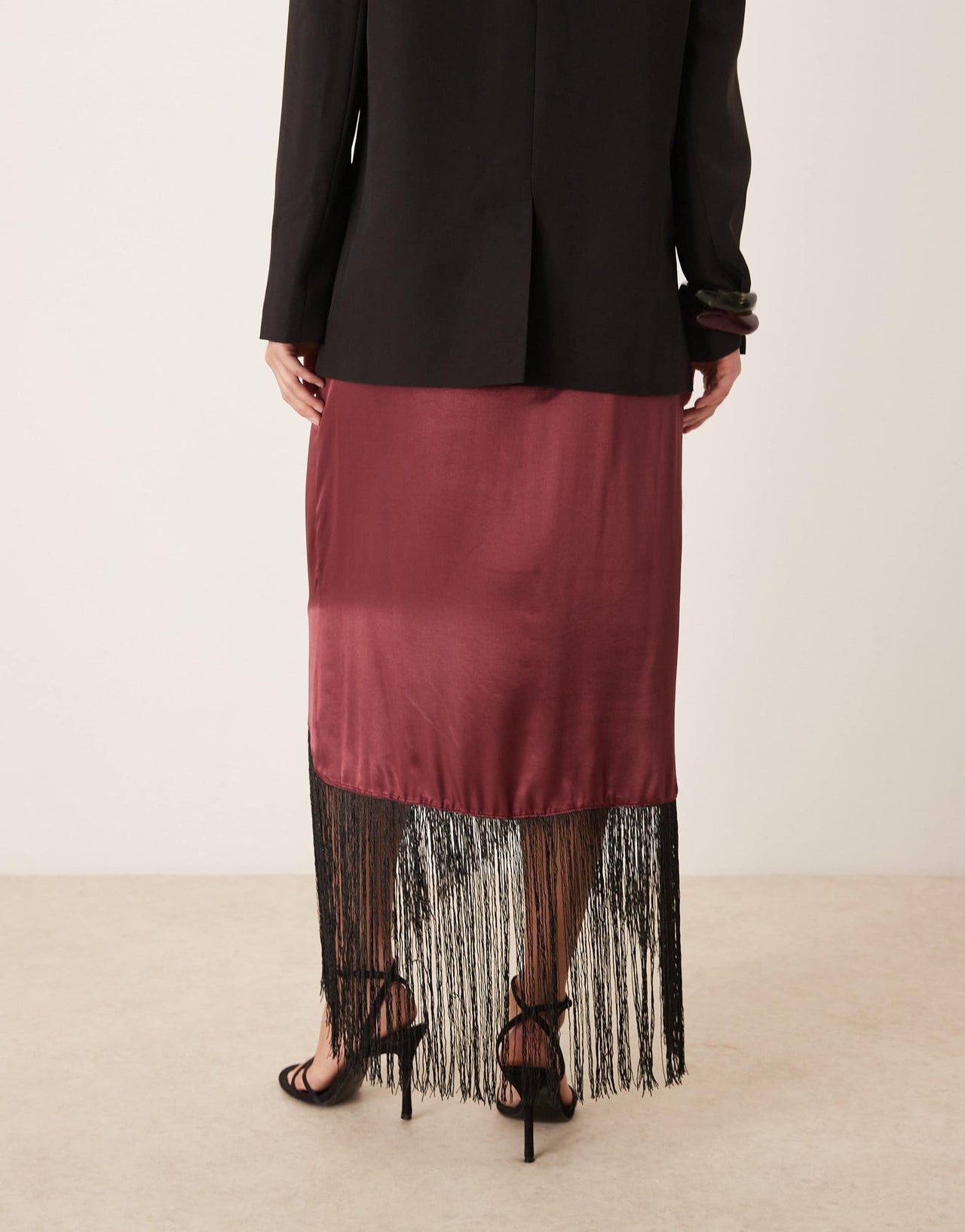 ASOS DESIGN satin wrap skirt with fringe hem in burgundy