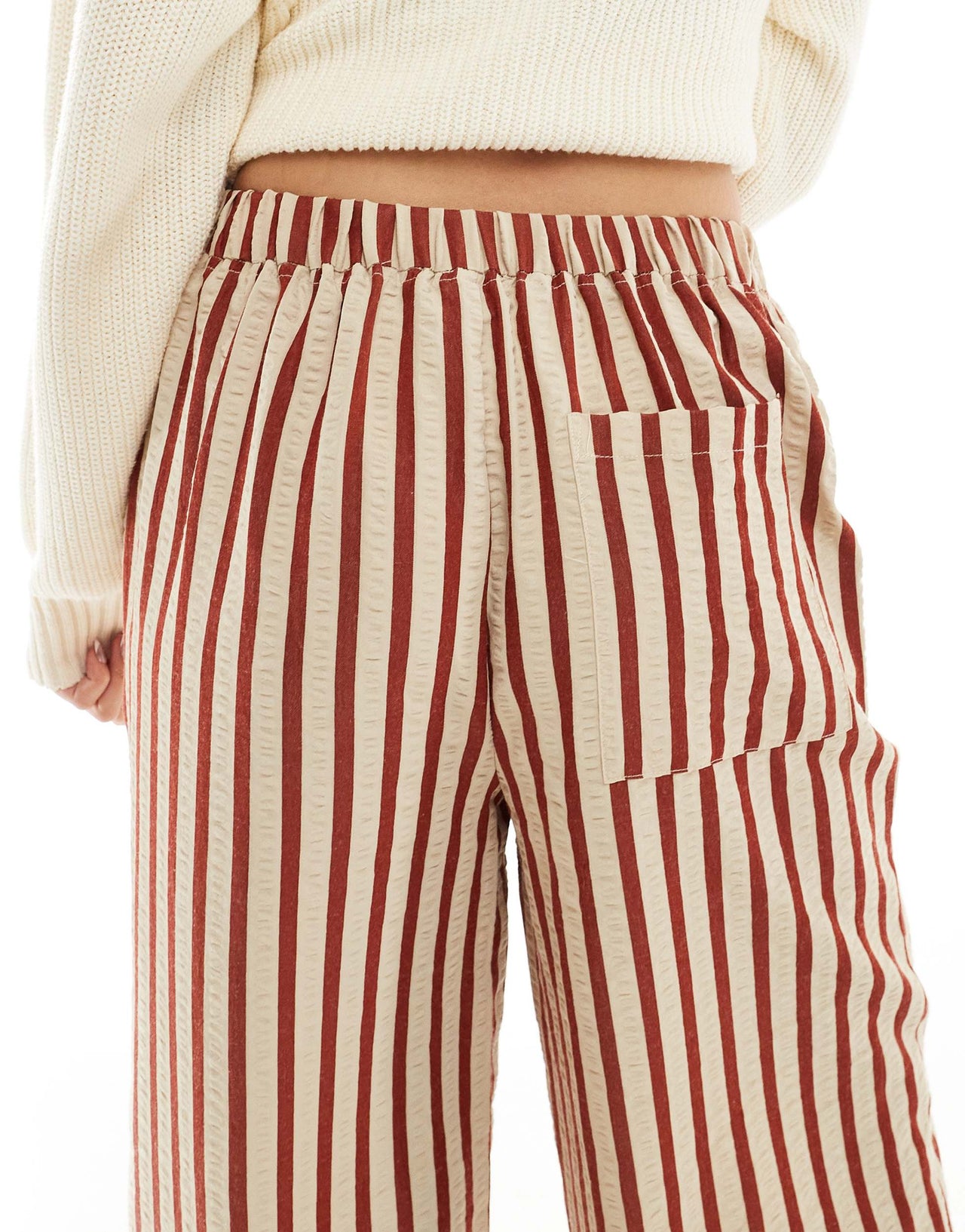 ASOS DESIGN straight leg seersucker trousers in rust stripe
