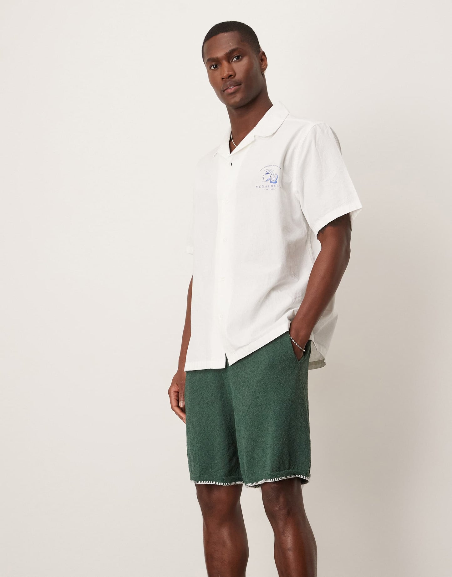 ASOS DESIGN oversized knitted shorts with blanket stitch in dark green