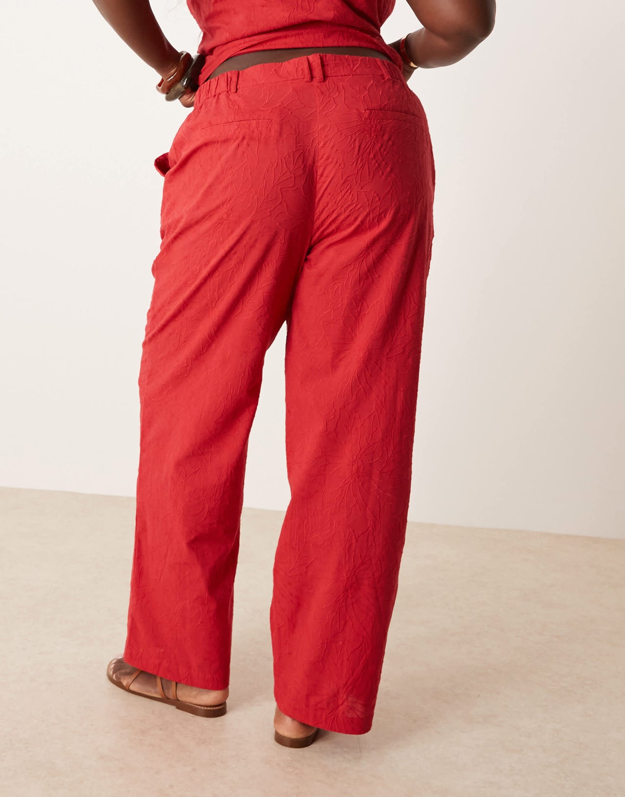 ASOS DESIGN Curve tailored flower textured relaxed trousers co-ord in red