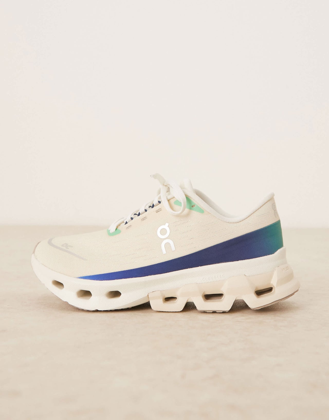 ON Cloudspark running trainers in cream and blue