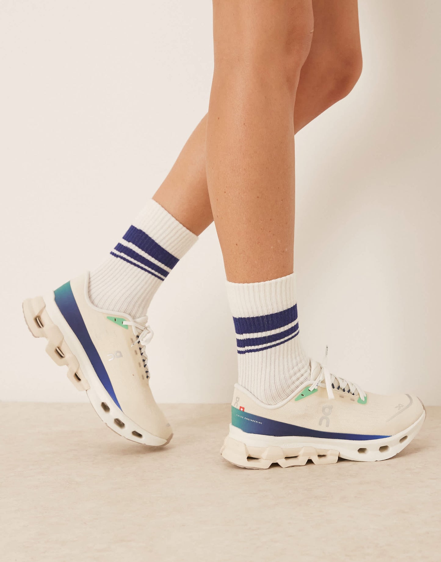 ON Cloudspark running trainers in cream and blue
