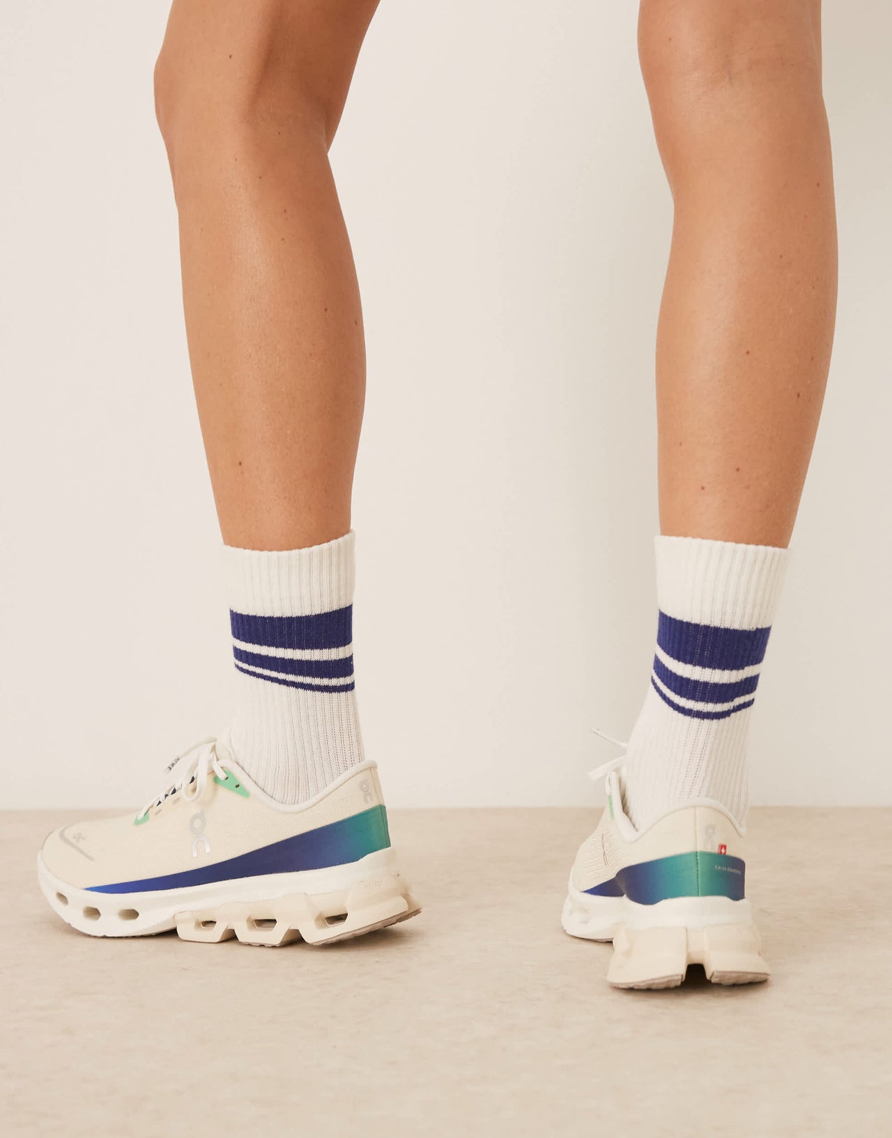 ON Cloudspark running trainers in cream and blue