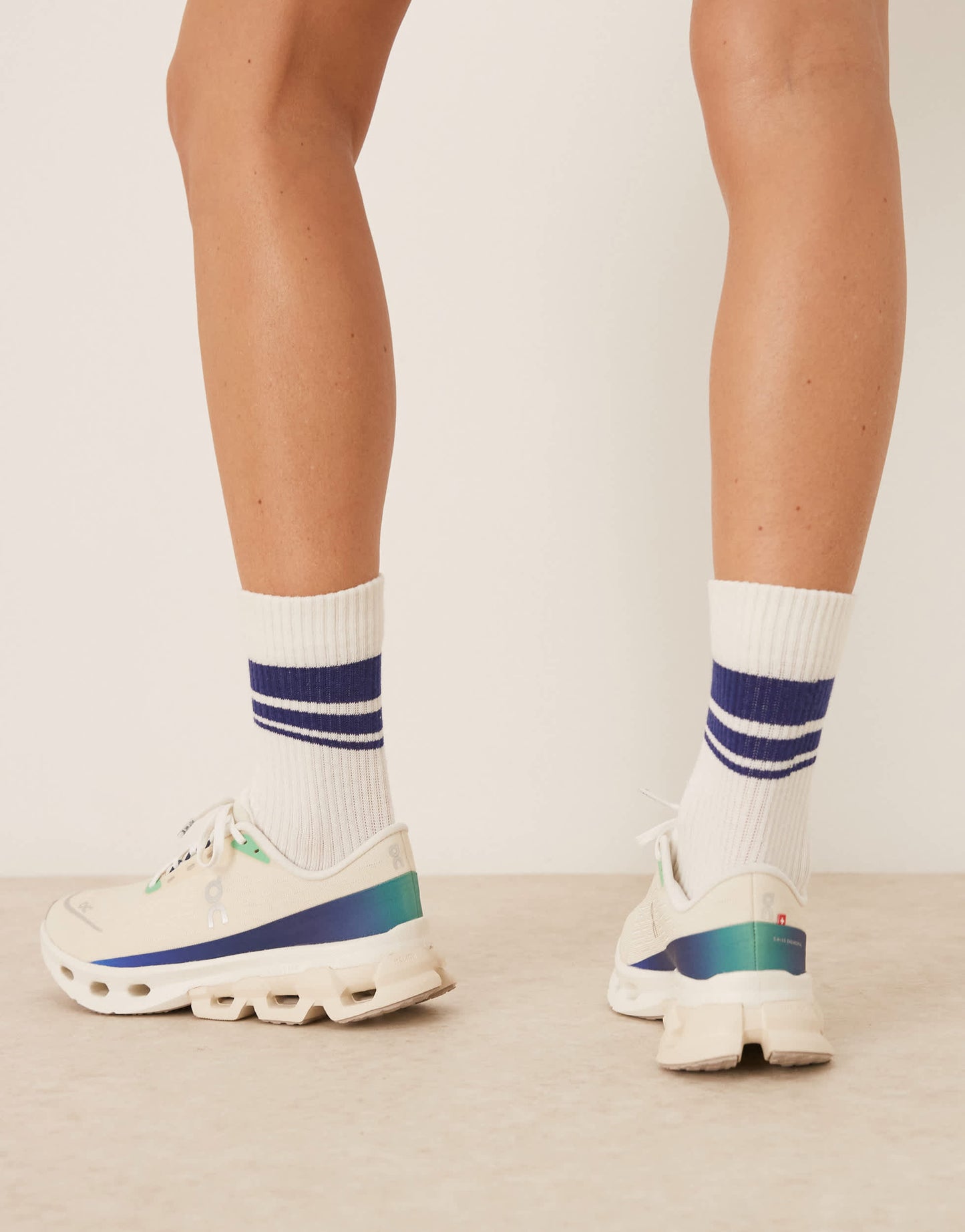 ON Cloudspark running trainers in cream and blue