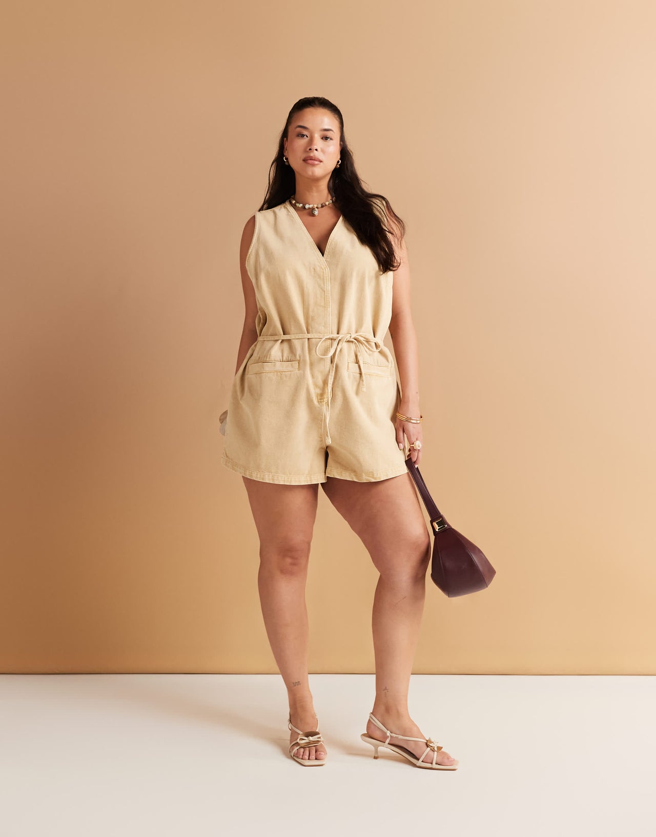 ASOS DESIGN Curve denim sleeveless playsuit with tie back in tan