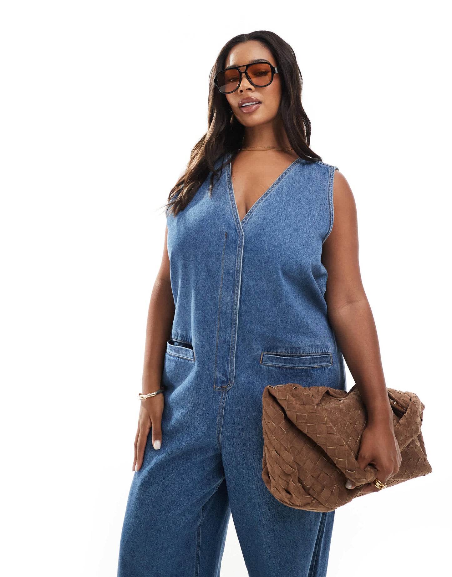 ASOS DESIGN Curve denim sleeveless loose jumpsuit in midwash blue