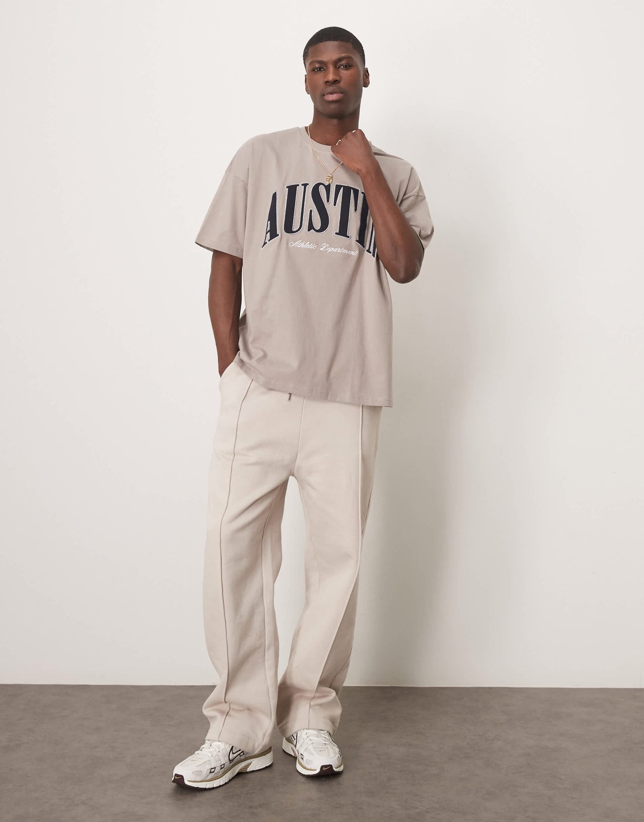 ASOS DESIGN oversized dropped shoulder t-shirt with city chest applique in brown