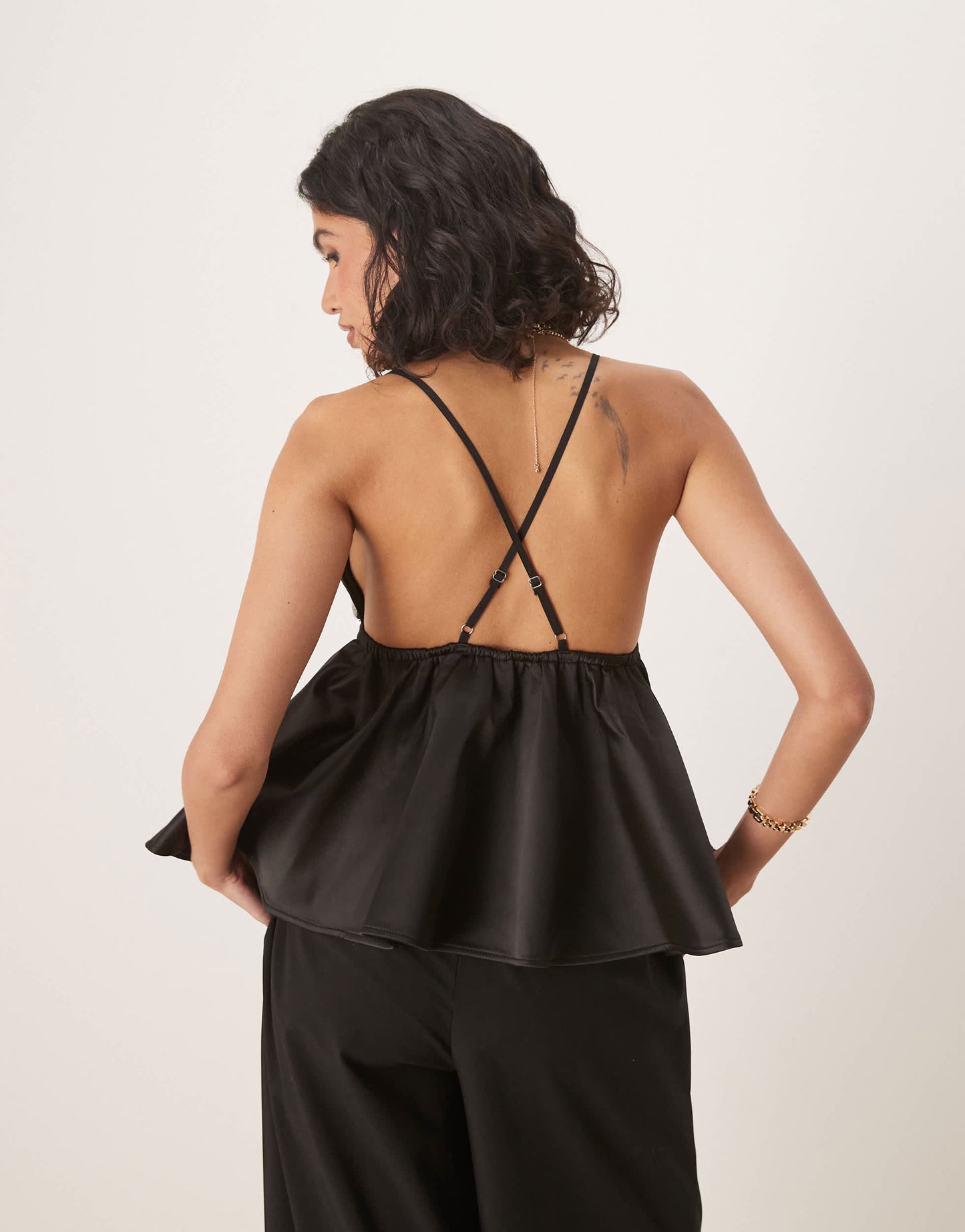 ASOS DESIGN sequin bust with peplum cami top in black