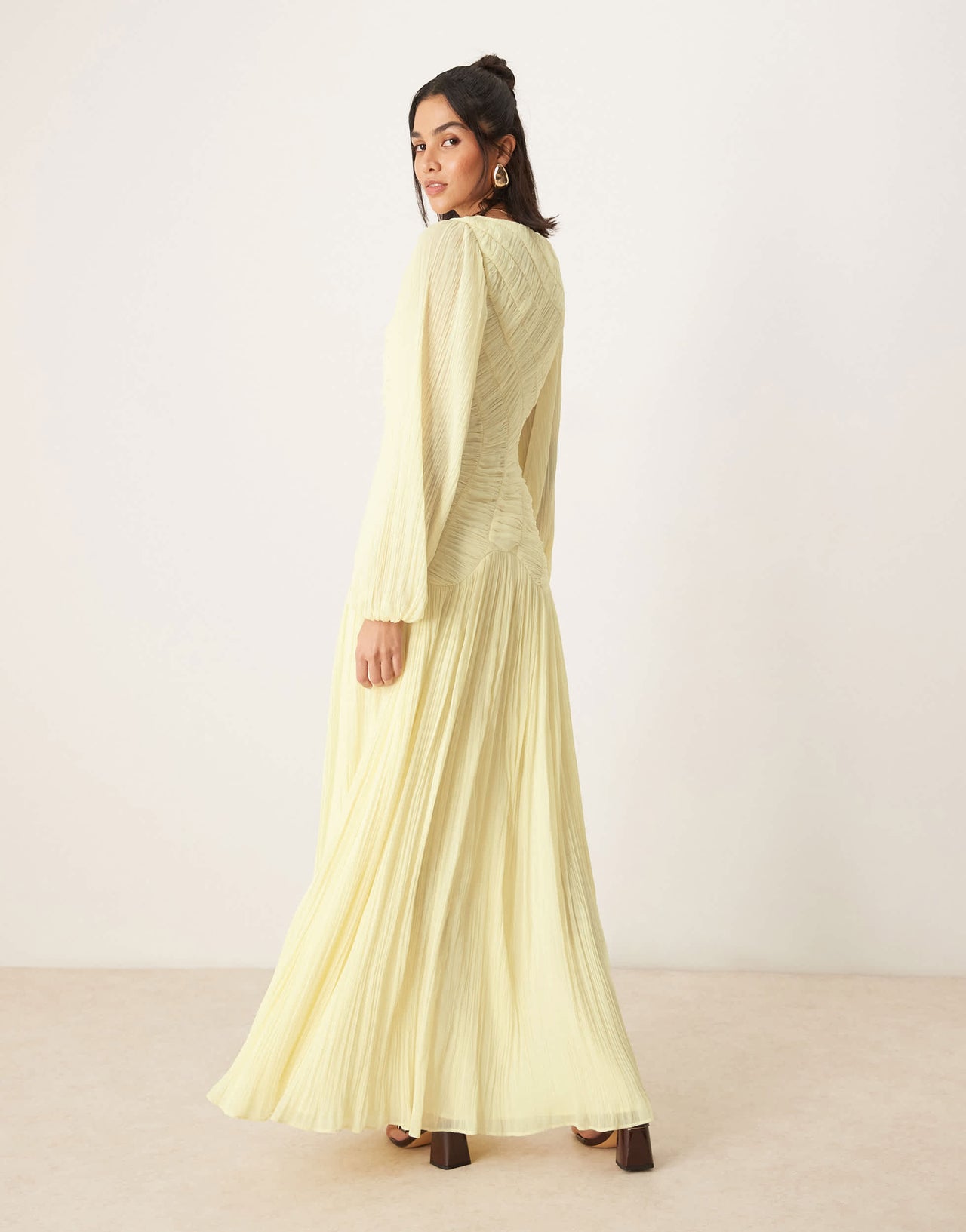 ASOS DESIGN long sleeve shirred crinkle maxi dress with dropped waist in lemon yellow