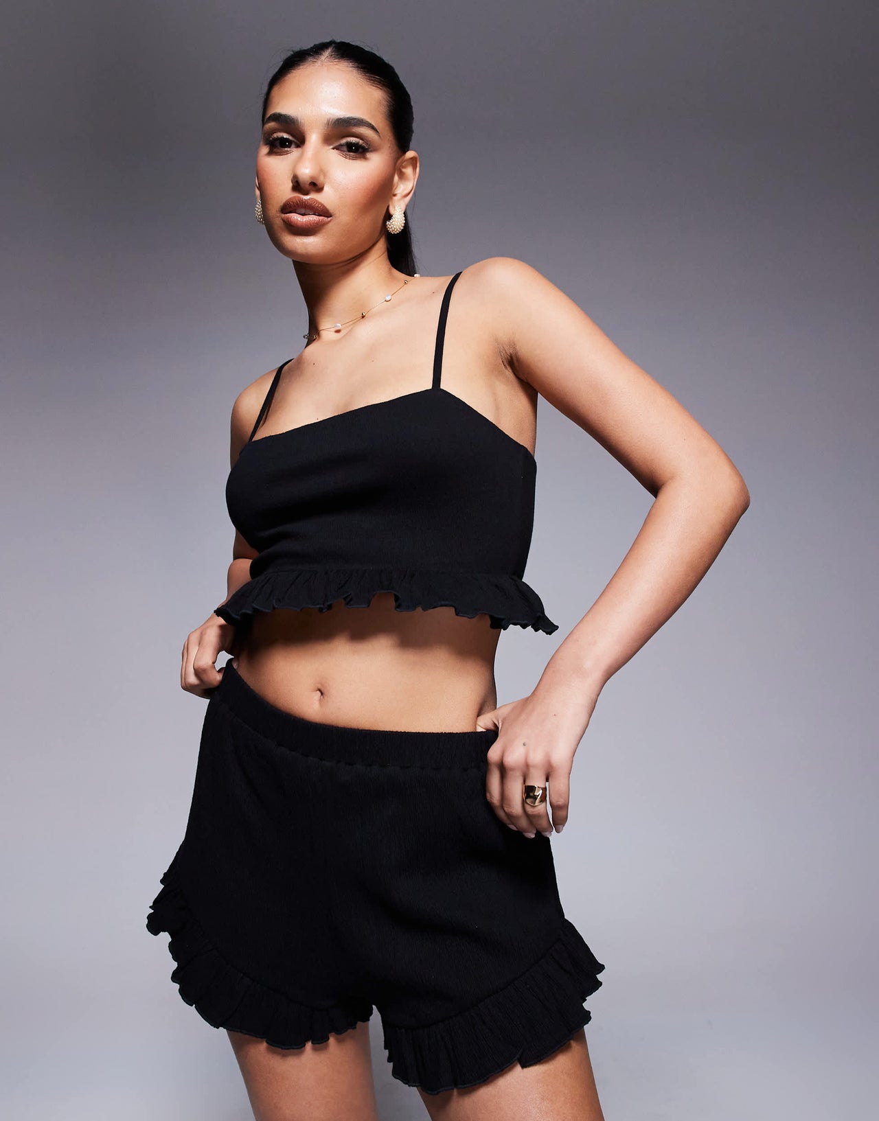 ASOS DESIGN co-ord crinkle flippy shorts with frill hem in black