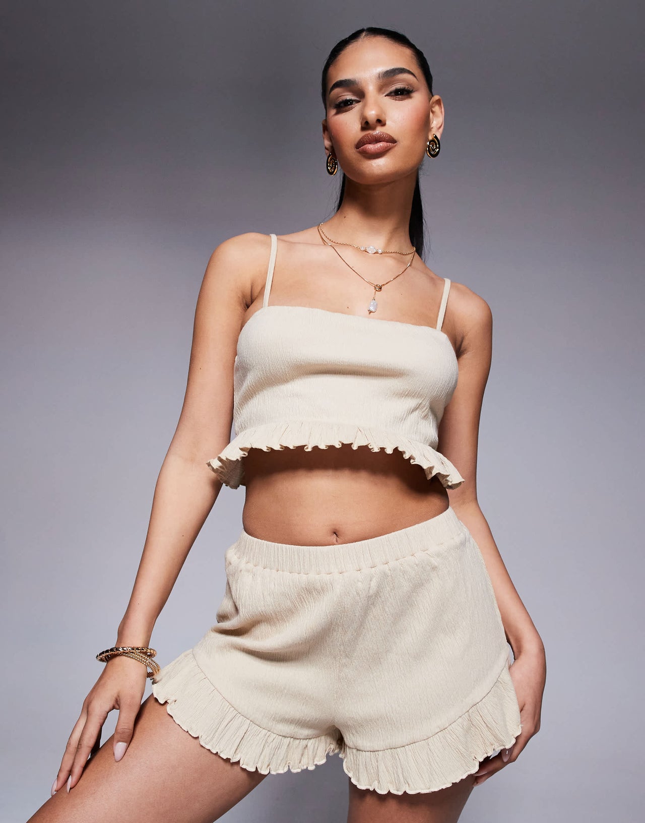 ASOS DESIGN co-ord crinkle flippy shorts with frill hem in stone