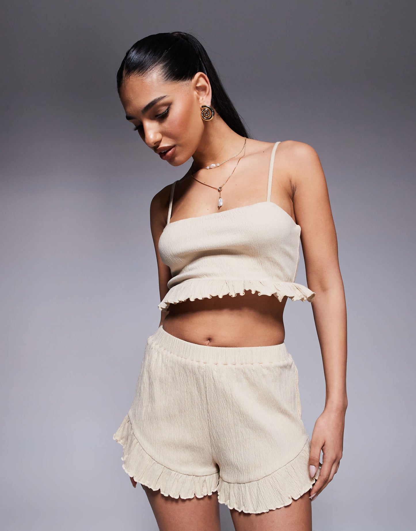 ASOS DESIGN co-ord crinkle flippy shorts with frill hem in stone