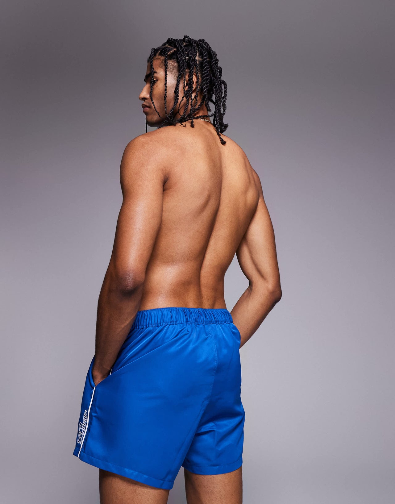 ASOS DESIGN swim shorts in short length with embroidery in blue
