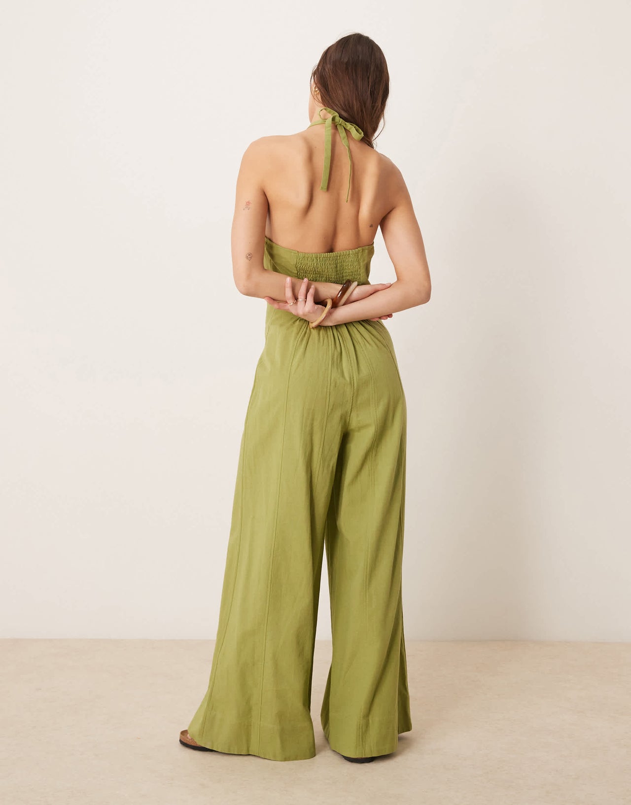 ASOS DESIGN halterneck seamed jumspuit with wide leg in sage