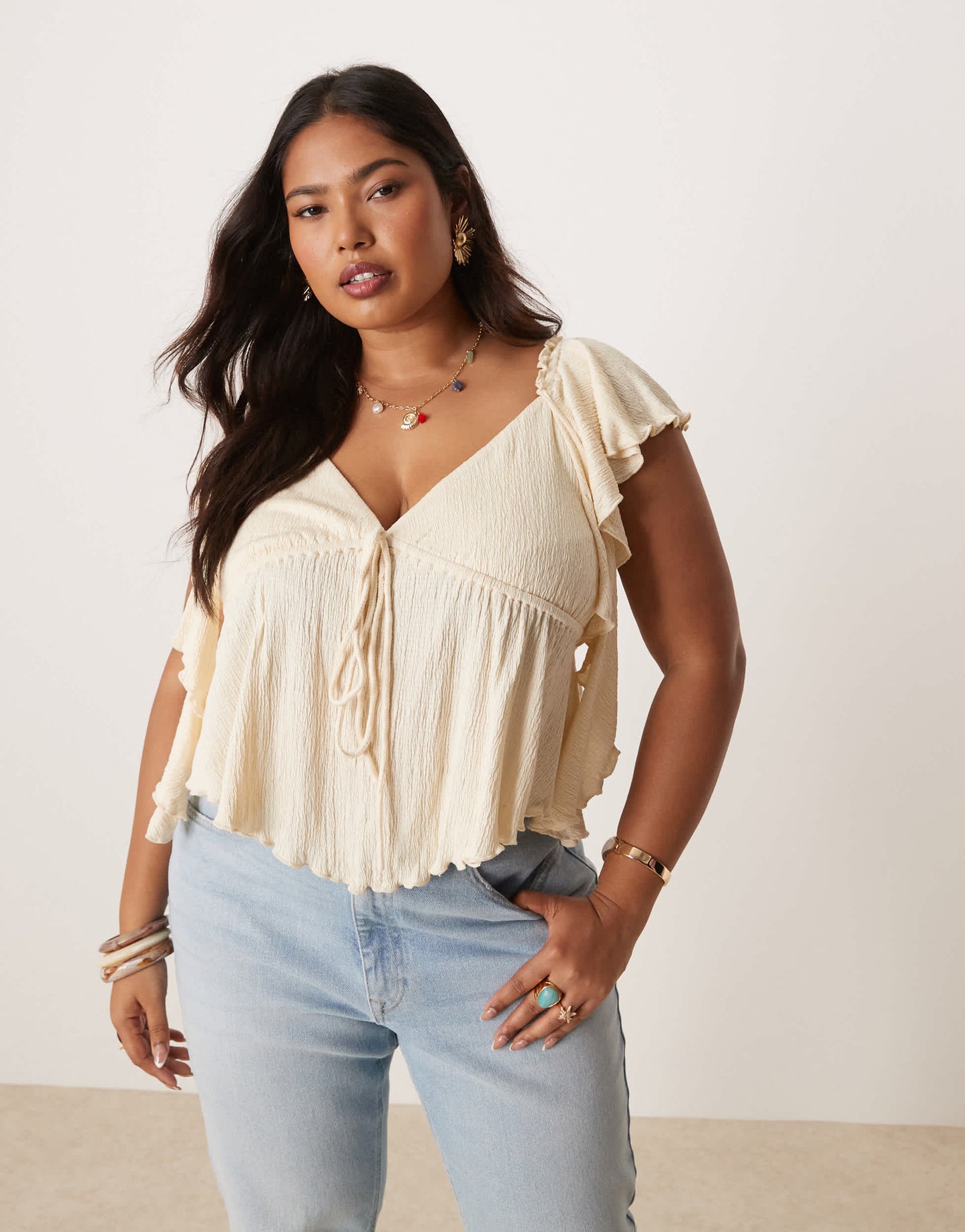 ASOS DESIGN Curve crinkle flutter sleeve open back top in cream