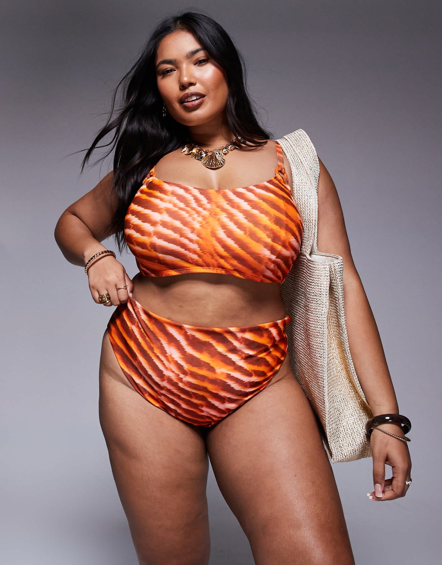 ASOS DESIGN Curve Charlie high waist bikini bottom in orange animal print