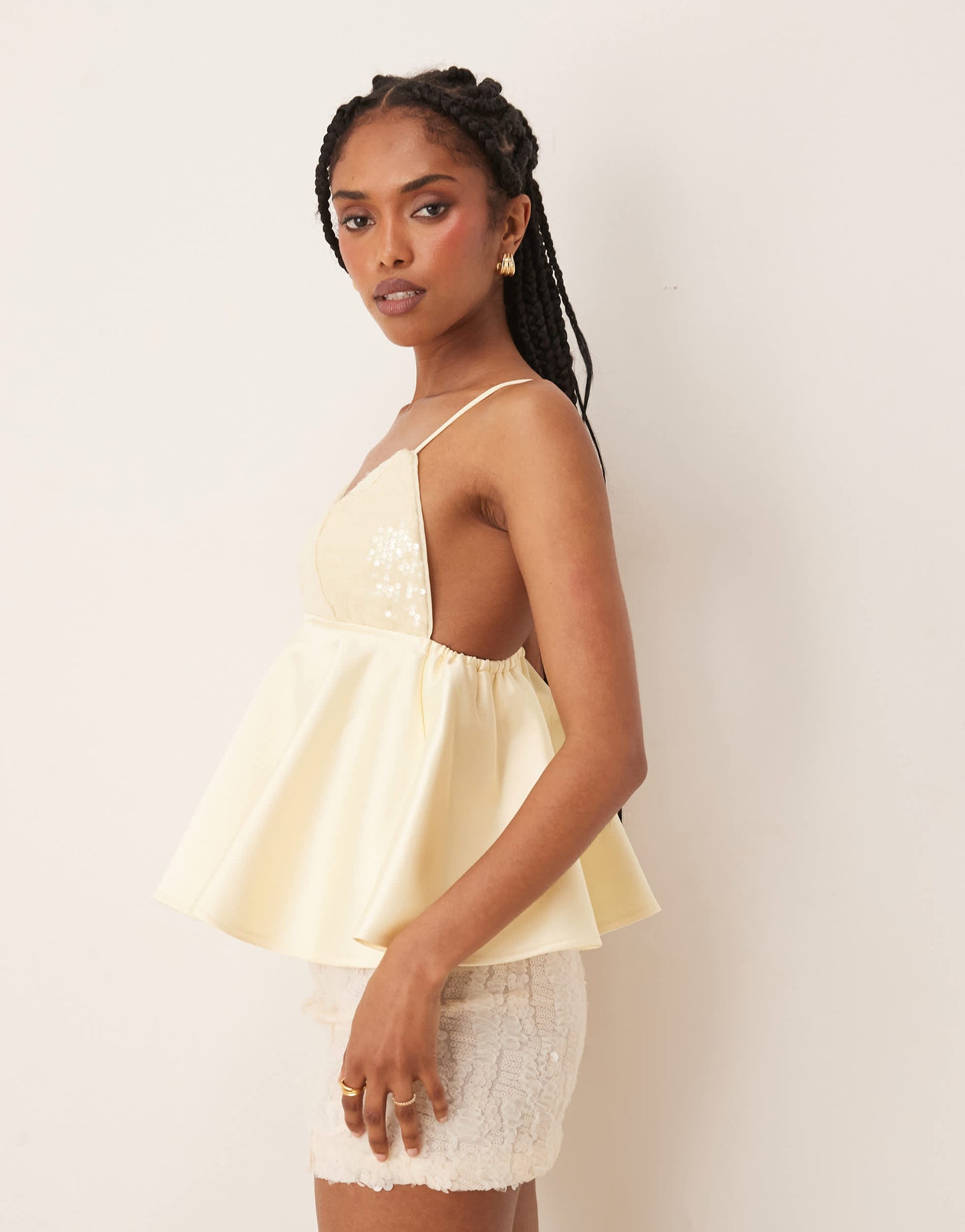 ASOS DESIGN Premium sequin bust cami with satin peplum hem in lemon yellow