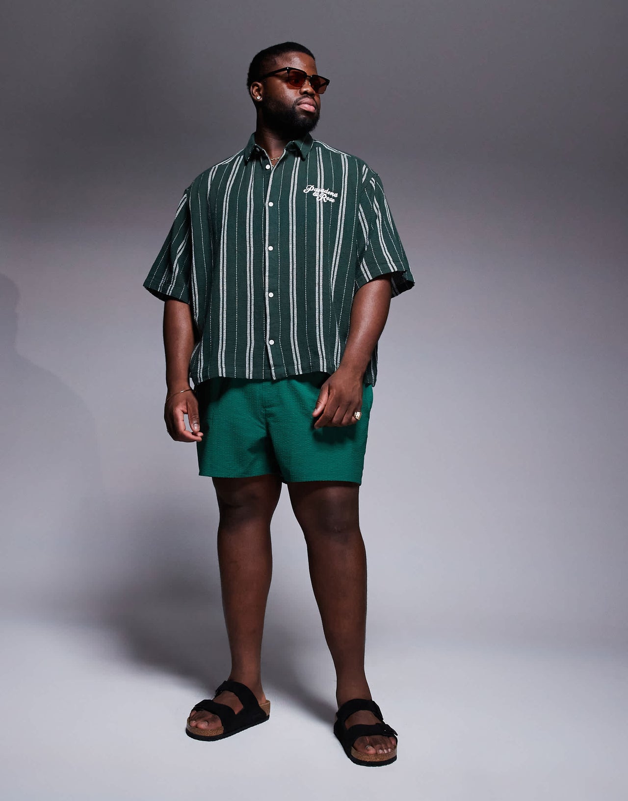 ASOS DESIGN seersucker swim shorts in short length in green
