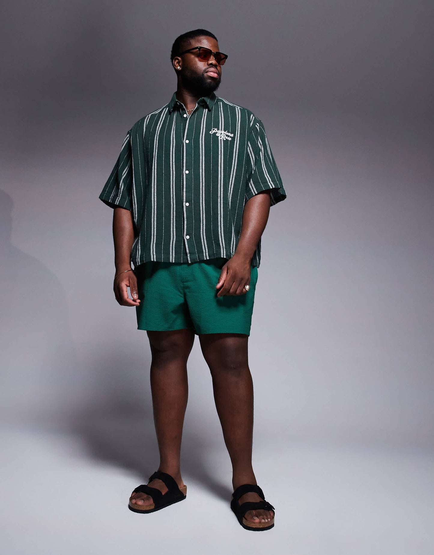 ASOS DESIGN seersucker swim shorts in short length in green