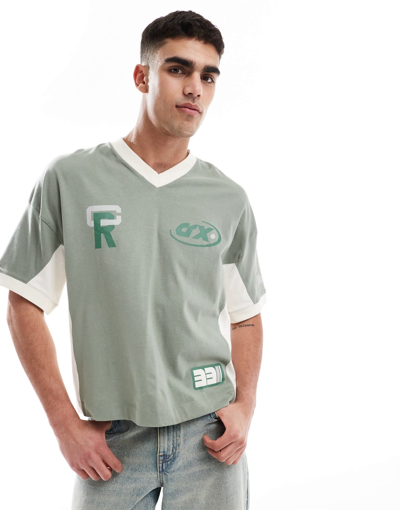 ASOS DESIGN boxy oversized dropped shoulder t-shirt with cut and sew panelling and sports graphics in green