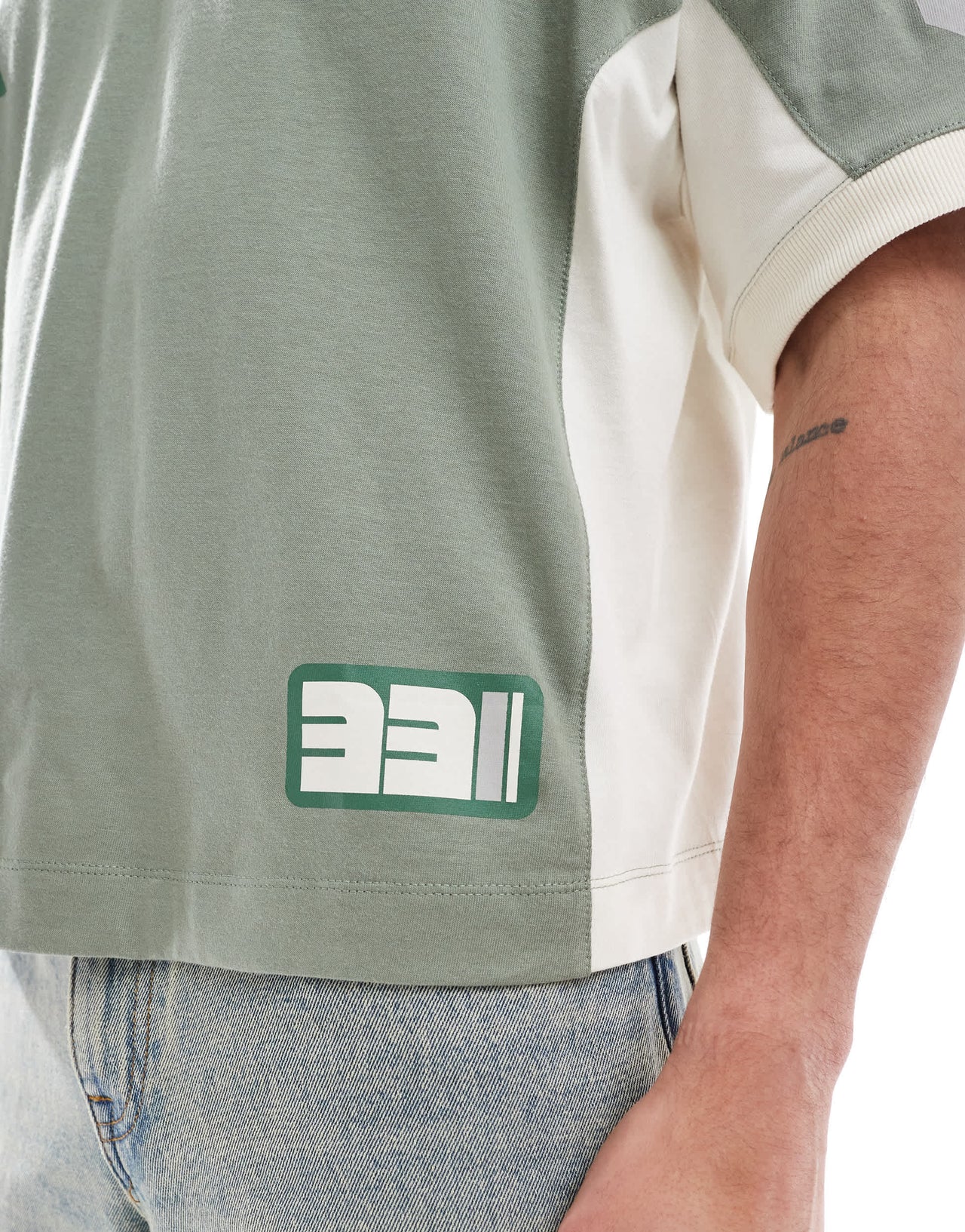 ASOS DESIGN boxy oversized dropped shoulder t-shirt with cut and sew panelling and sports graphics in green