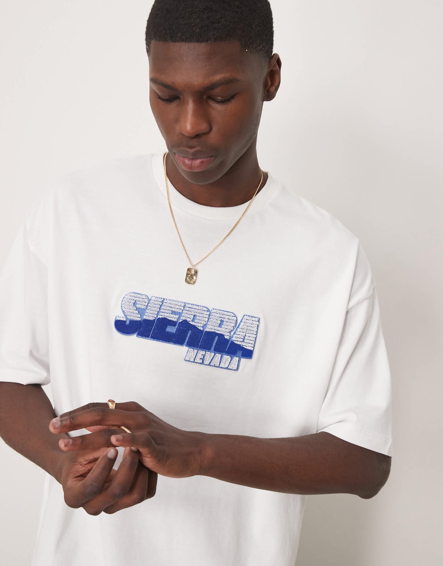 ASOS DESIGN oversized t-shirt with city chest graphic in white