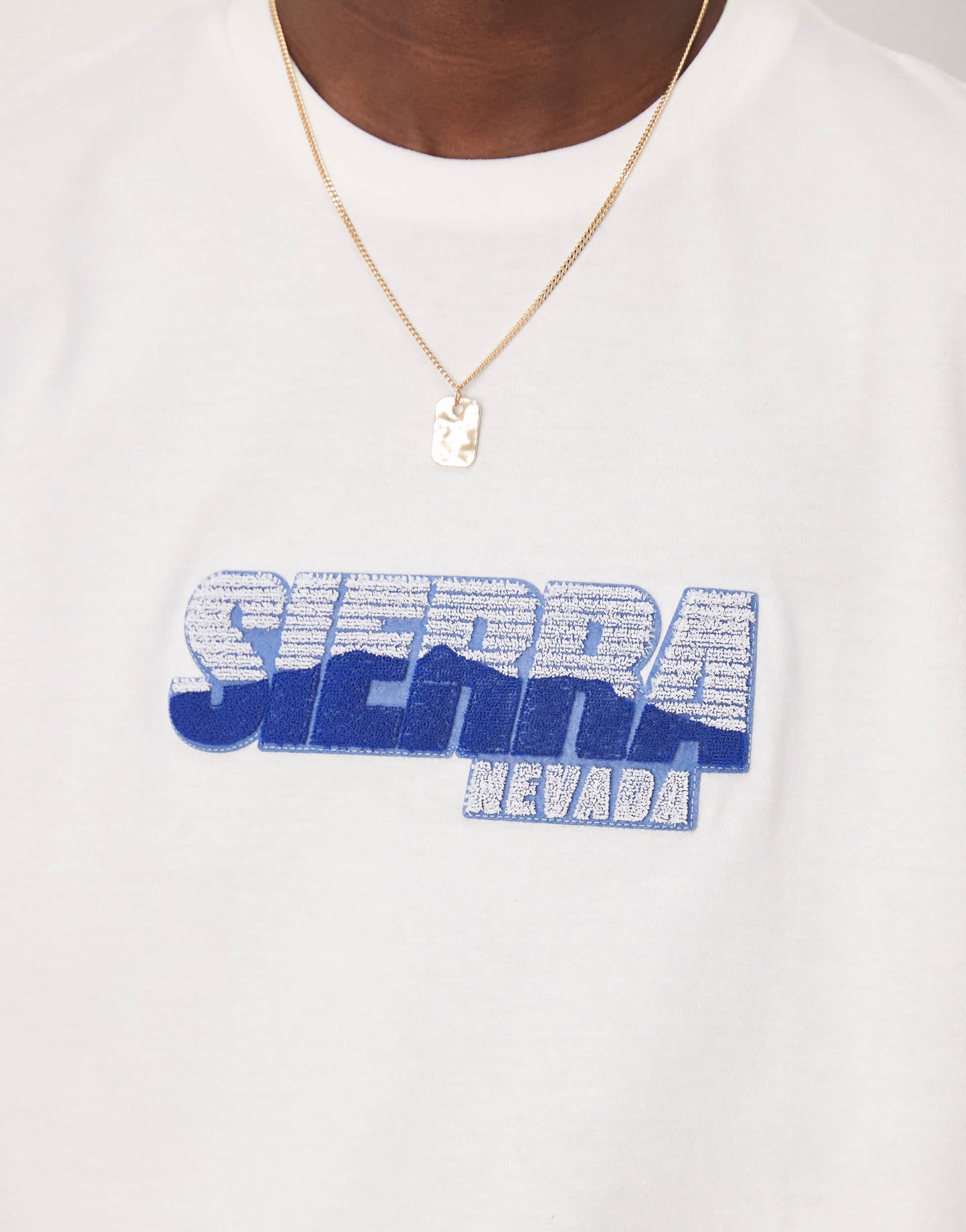 ASOS DESIGN oversized t-shirt with city chest graphic in white