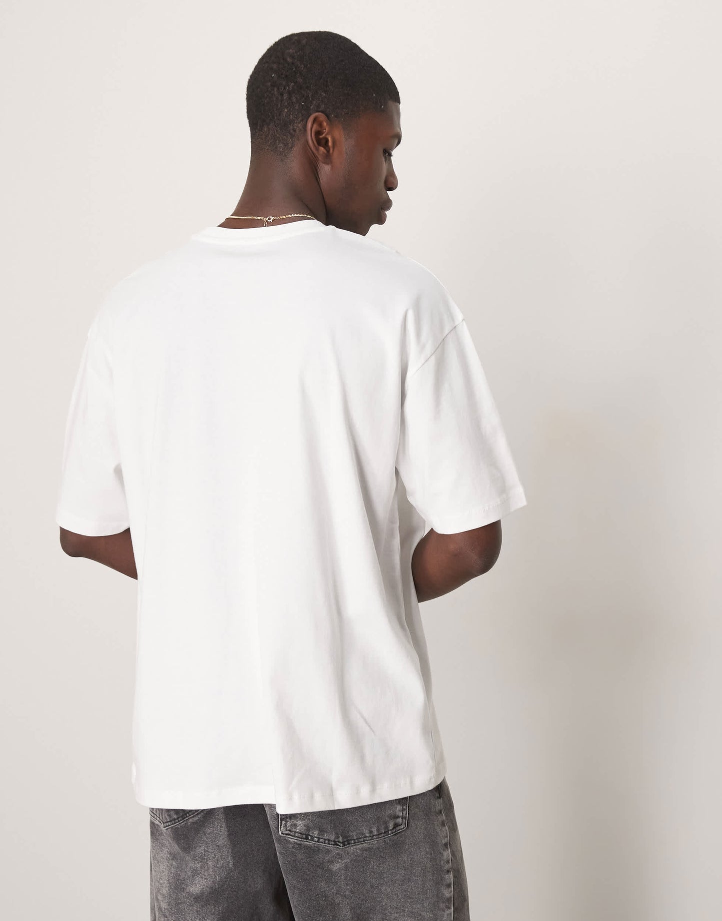 ASOS DESIGN oversized t-shirt with city chest graphic in white