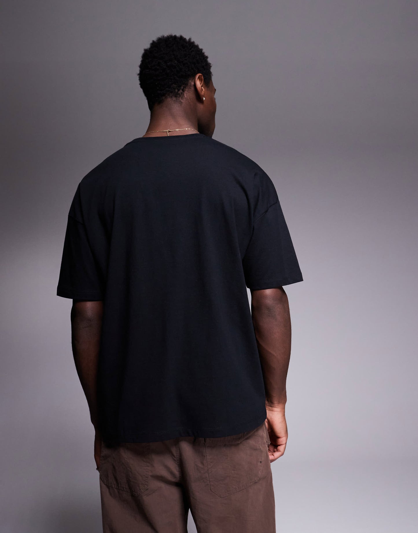 ASOS DESIGN oversized t-shirt with city text chest print in black