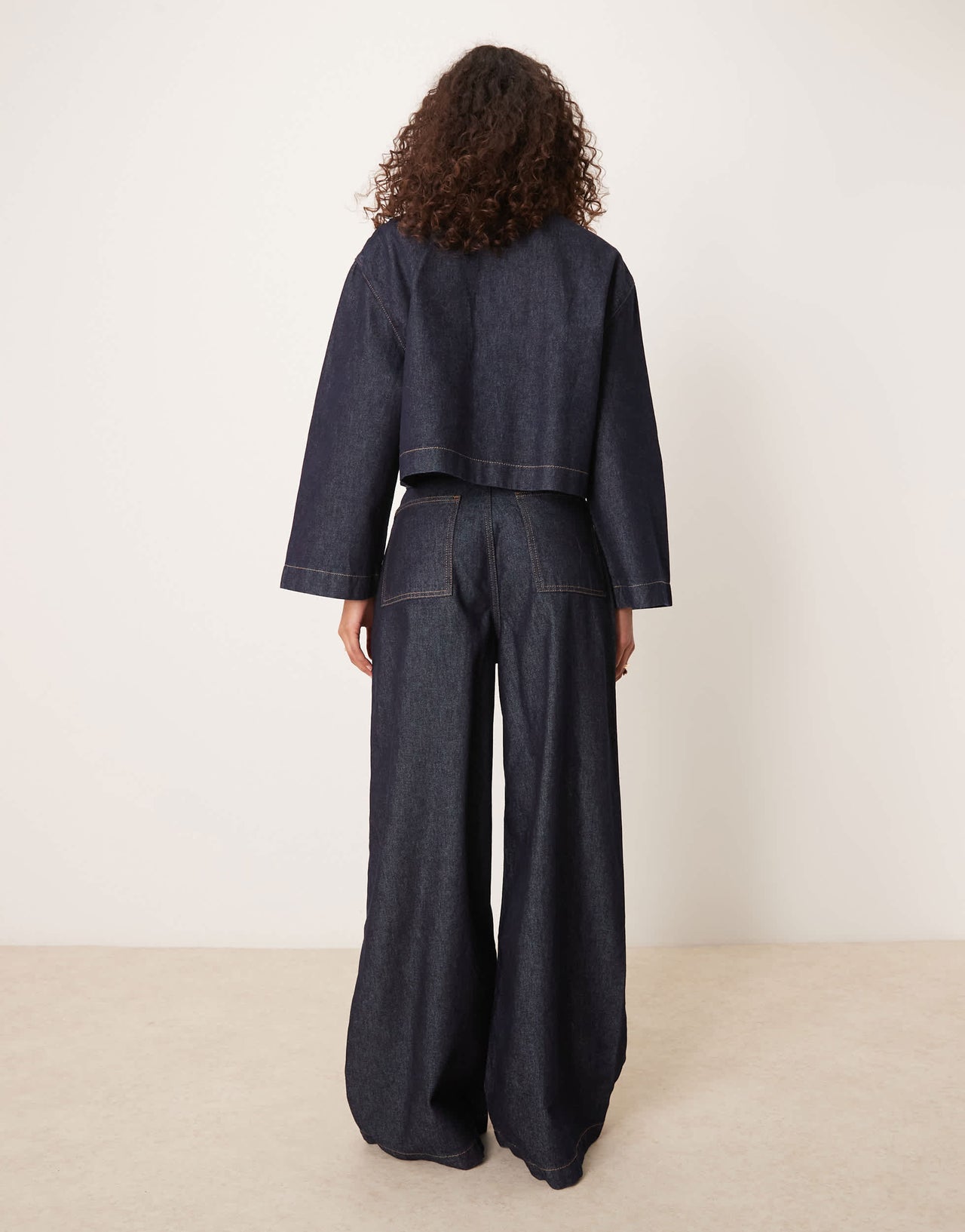 ASOS DESIGN wide leg jean with pleats in dark indigo