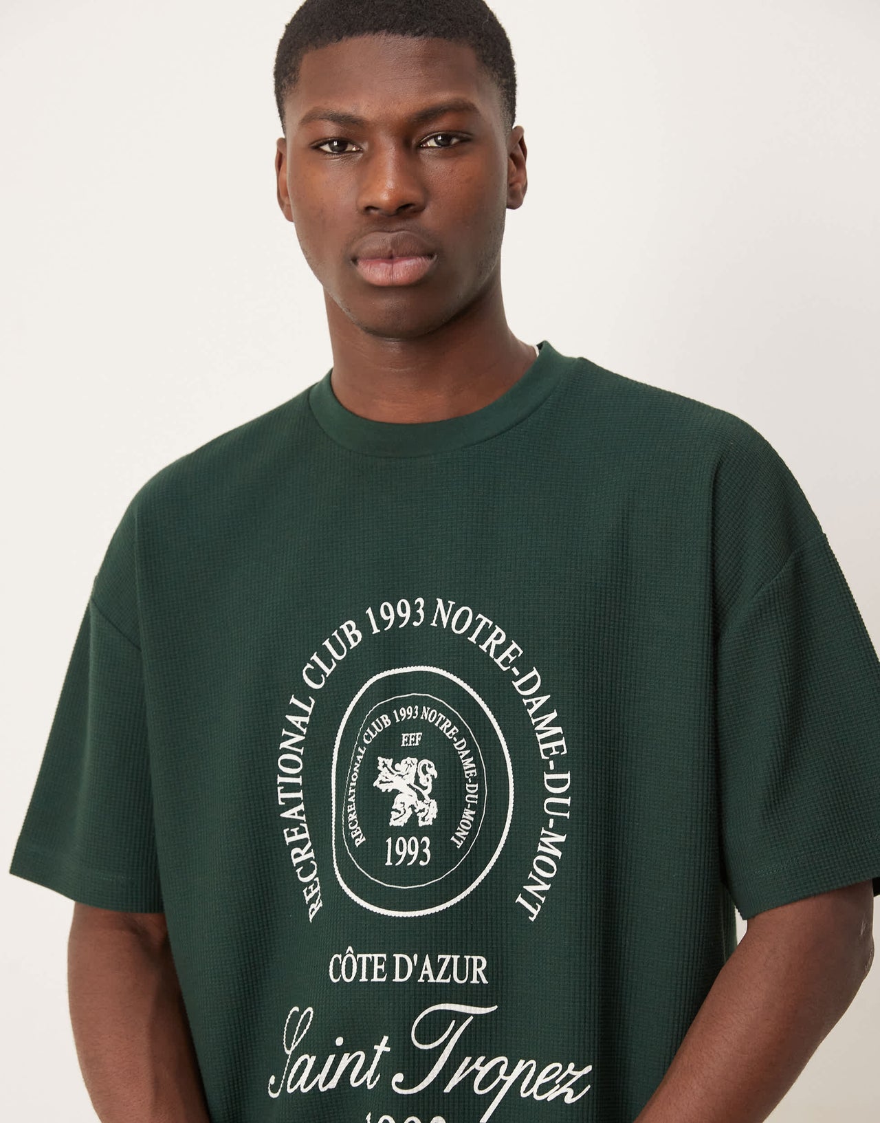ASOS DESIGN heavyweight oversized t-shirt in waffle texture with city graphic in dark green