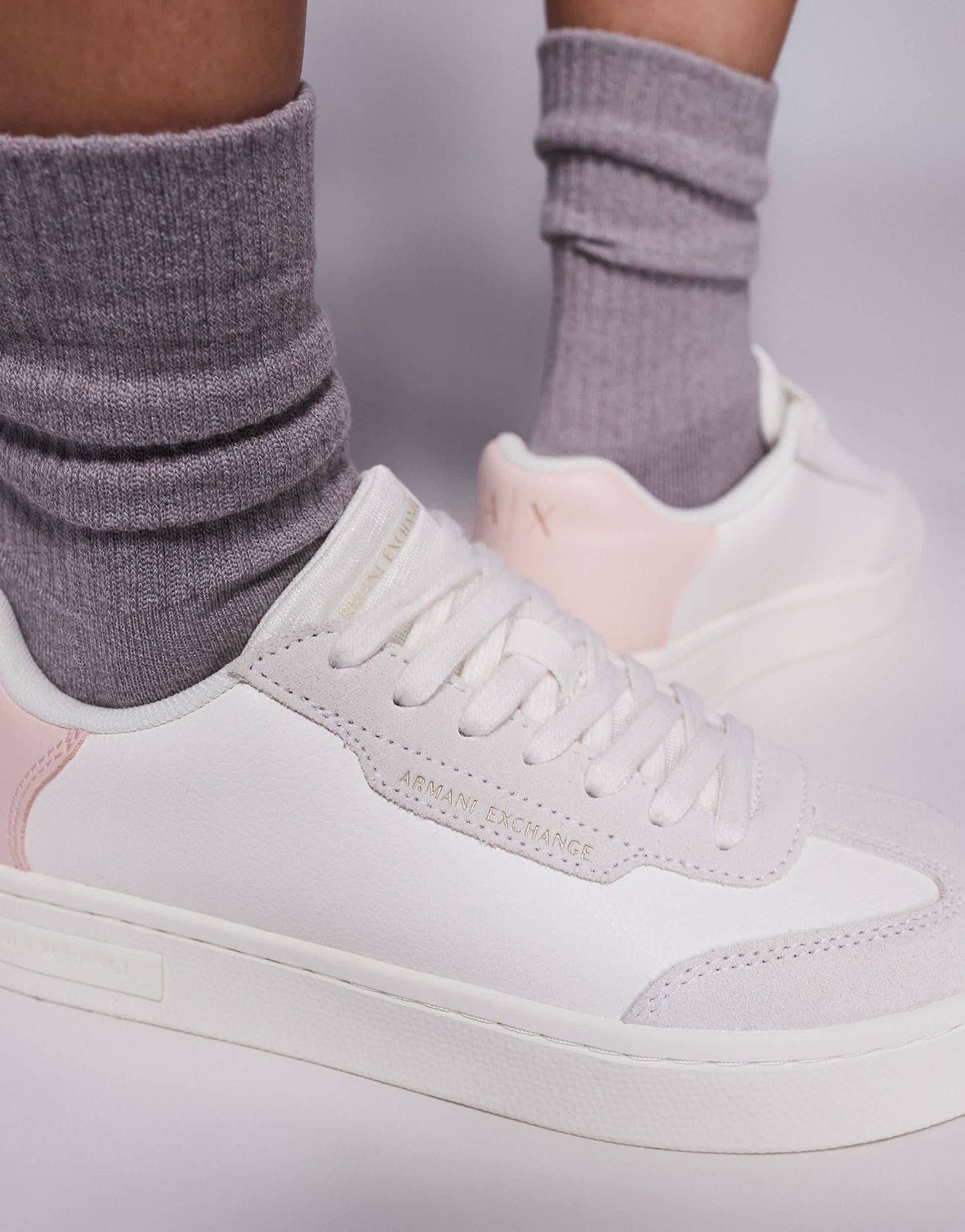 Armani Exchange logo trainers in off white and pink