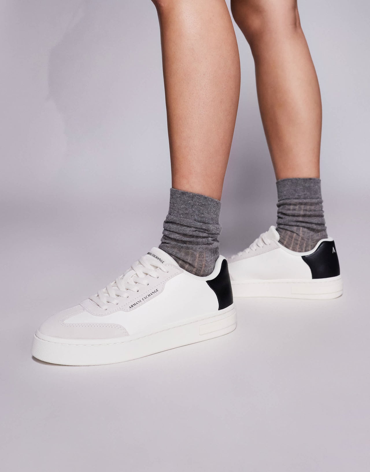 Armani Exchange logo trainers in off white and black