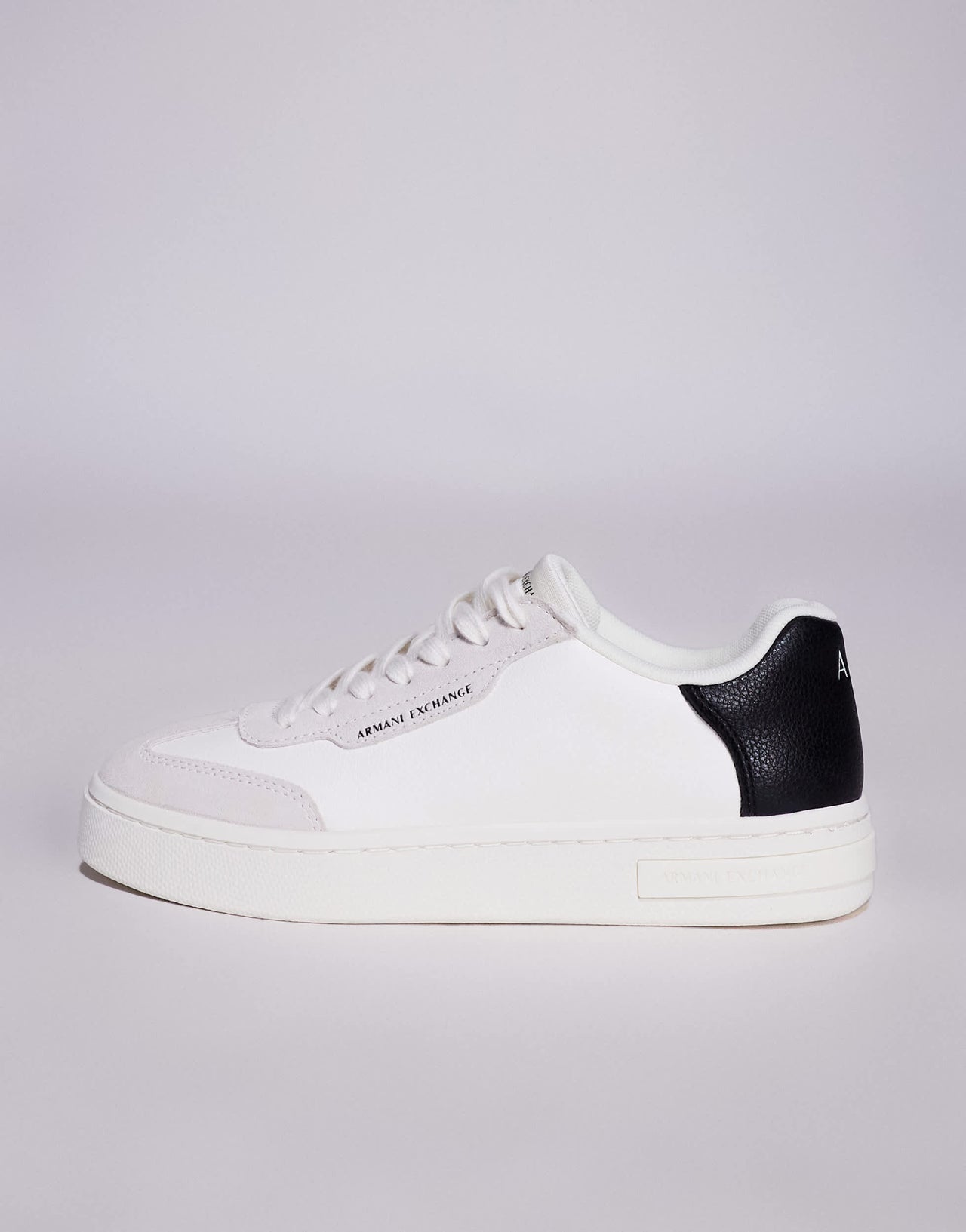 Armani Exchange logo trainers in off white and black