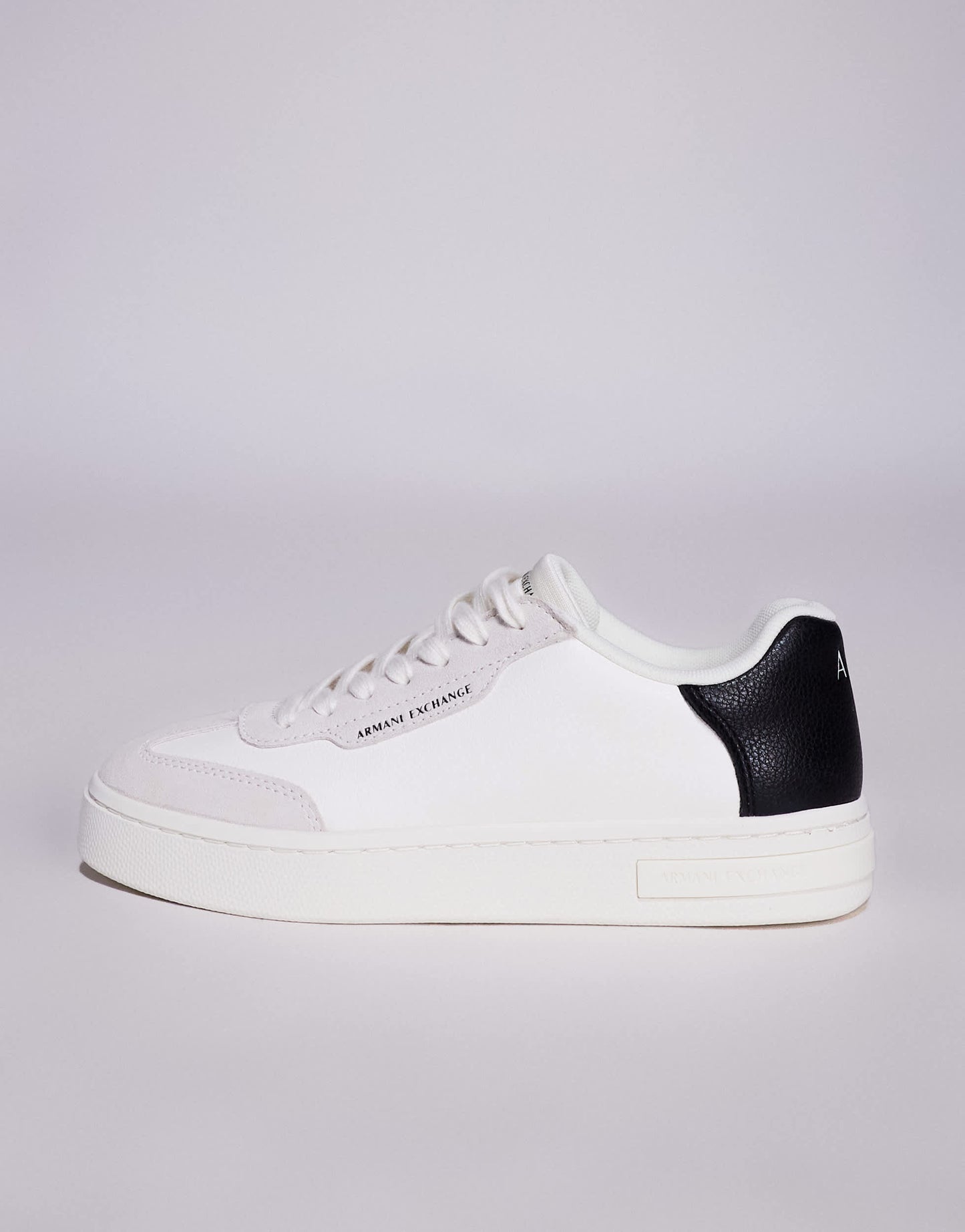 Armani Exchange logo trainers in off white and black