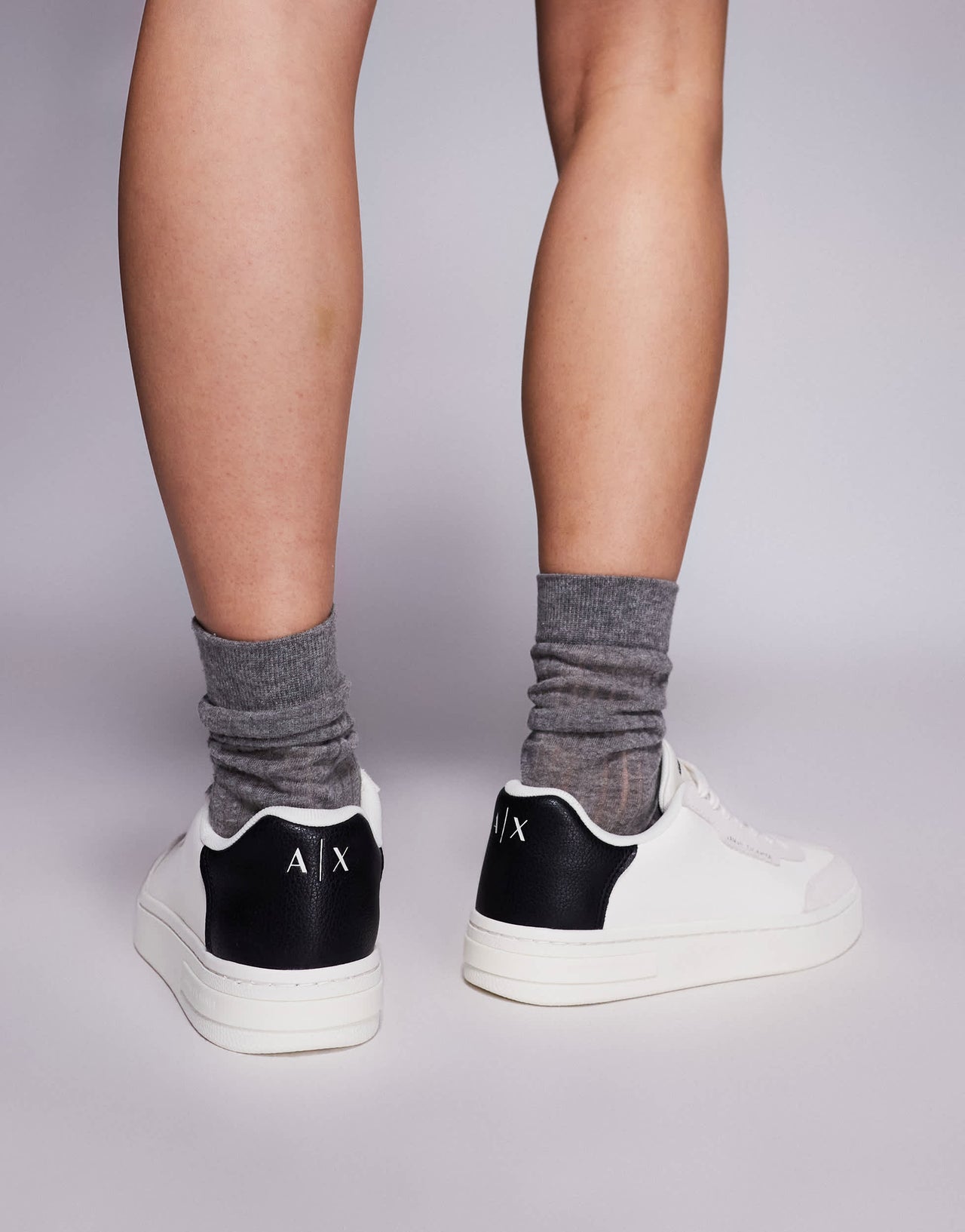 Armani Exchange logo trainers in off white and black