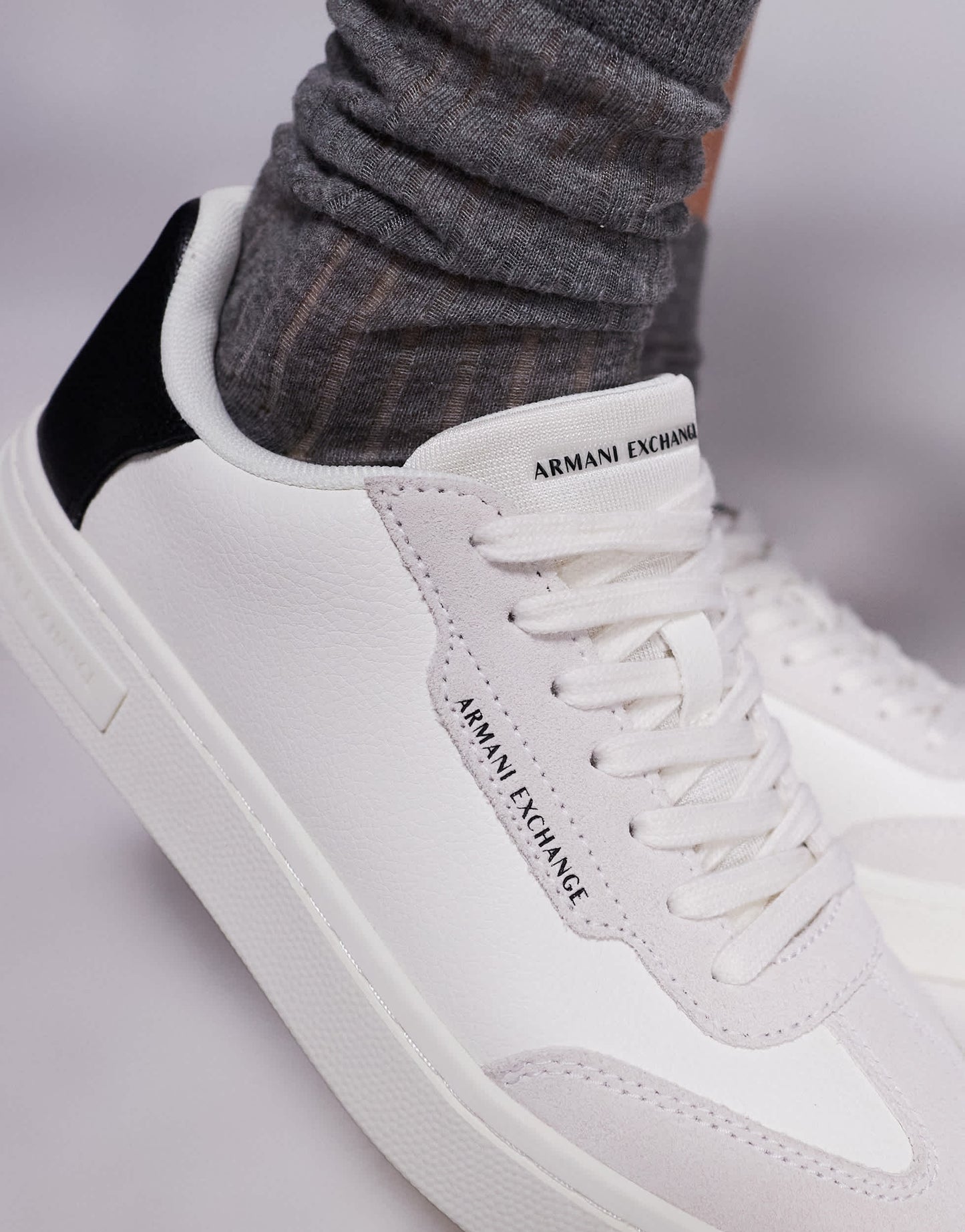 Armani Exchange logo trainers in off white and black