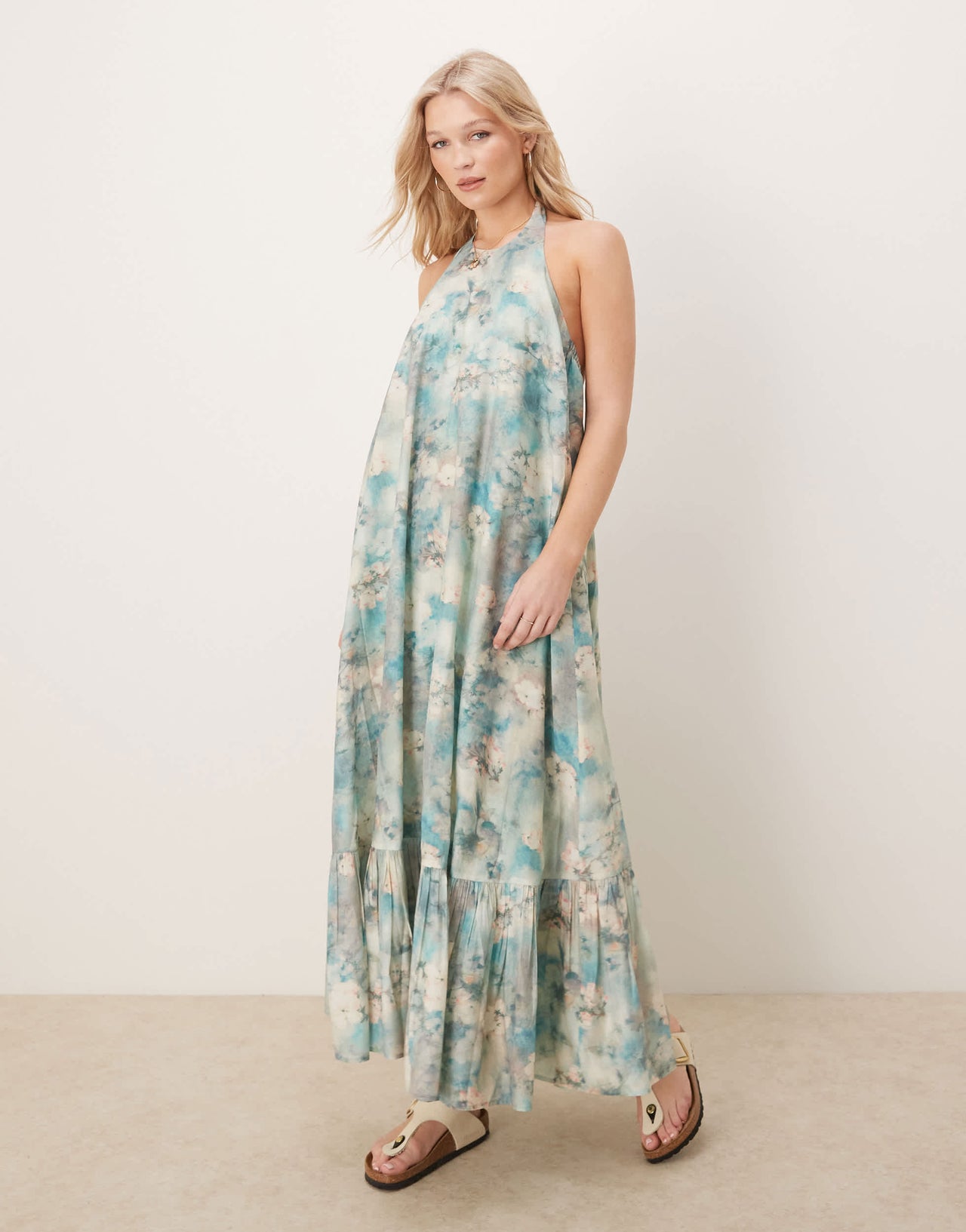 ASOS DESIGN halter maxi dress with ruffle hem in blurred floral print