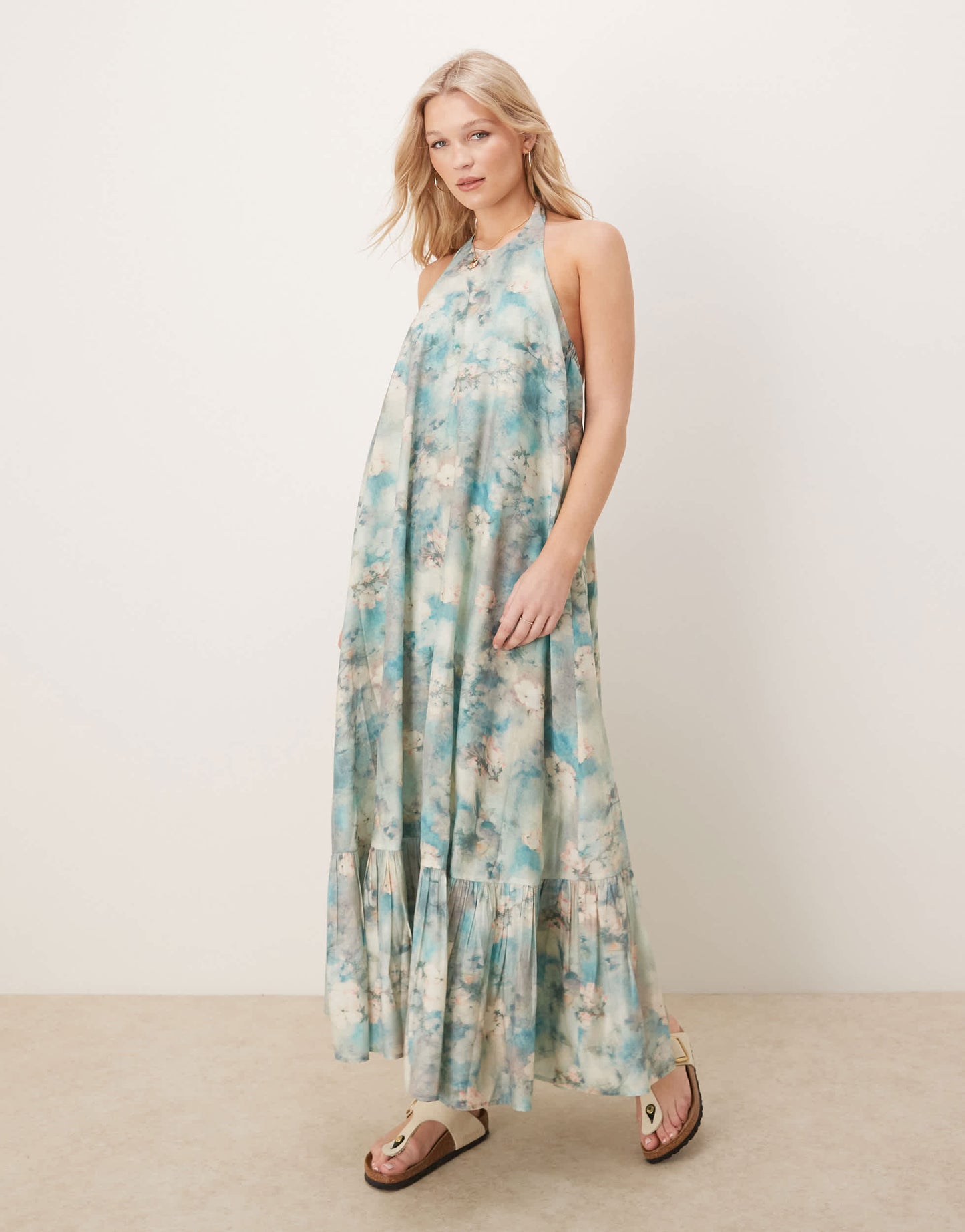 ASOS DESIGN halter maxi dress with ruffle hem in blurred floral print