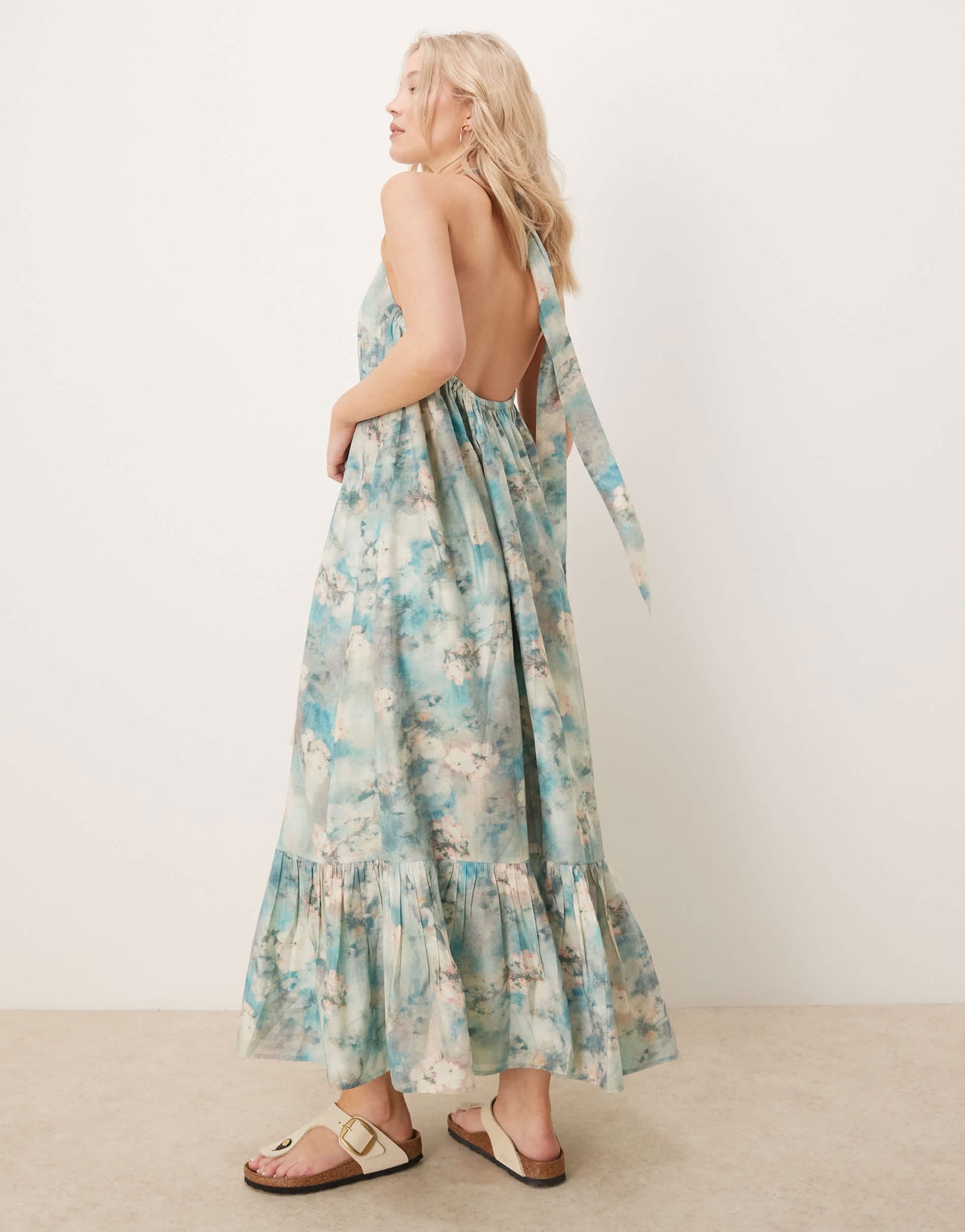 ASOS DESIGN halter maxi dress with ruffle hem in blurred floral print