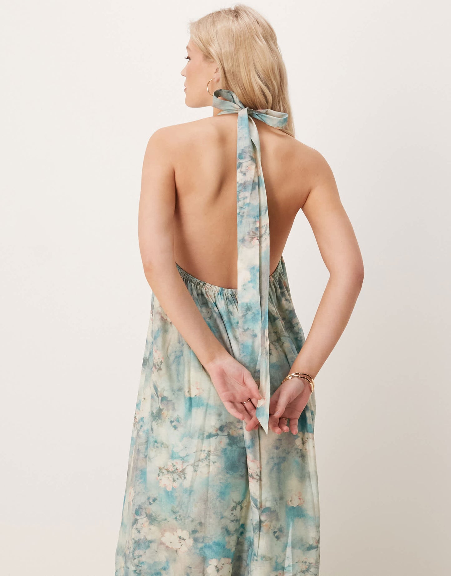 ASOS DESIGN halter maxi dress with ruffle hem in blurred floral print