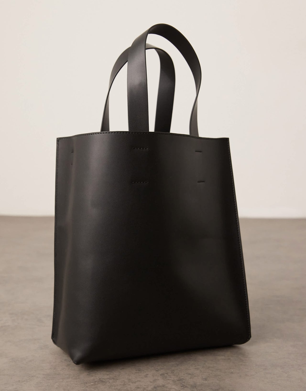 ASOS DESIGN faux leather tote bag with crossbody strap in black
