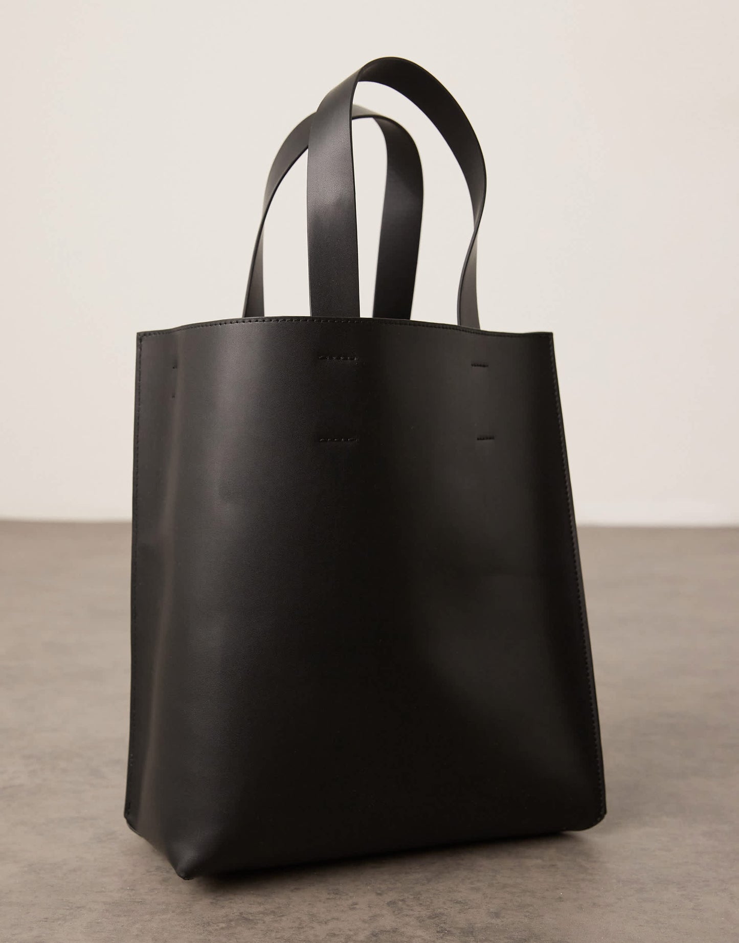 ASOS DESIGN faux leather tote bag with crossbody strap in black